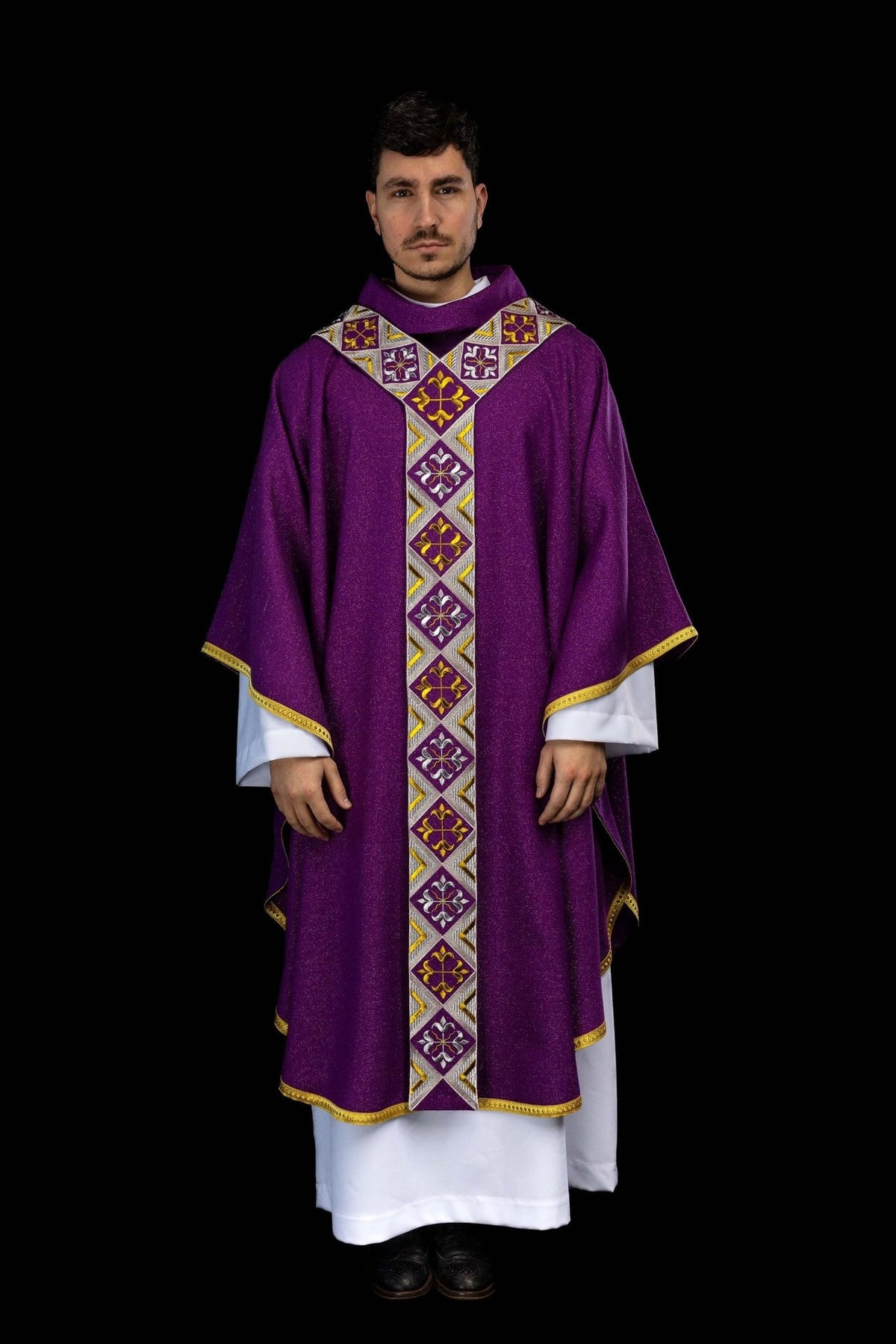 Purple orphrey detail worn diagonally across the purple chasuble