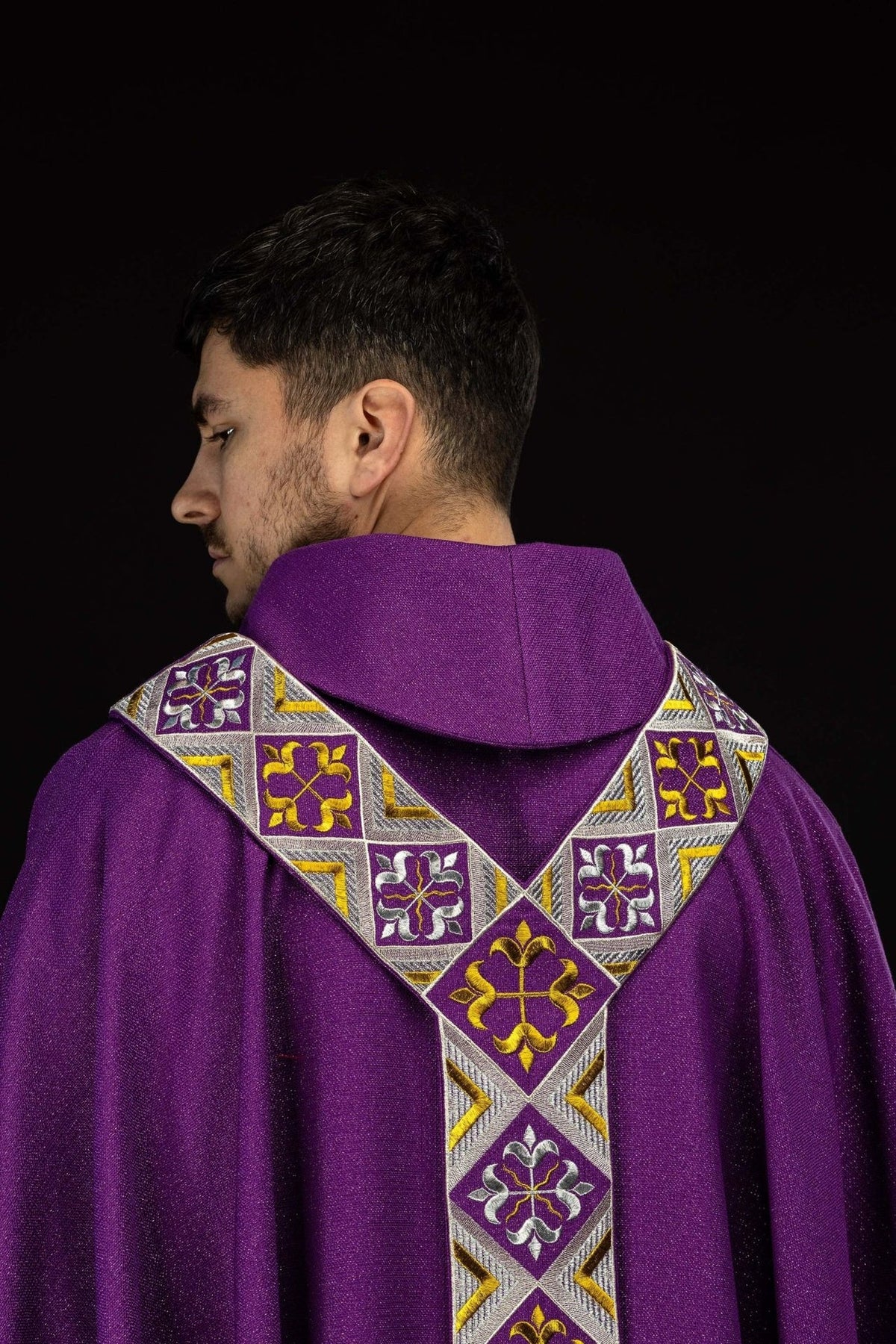 Purple chasuble front upper view with V-shaped embroidered orphrey
