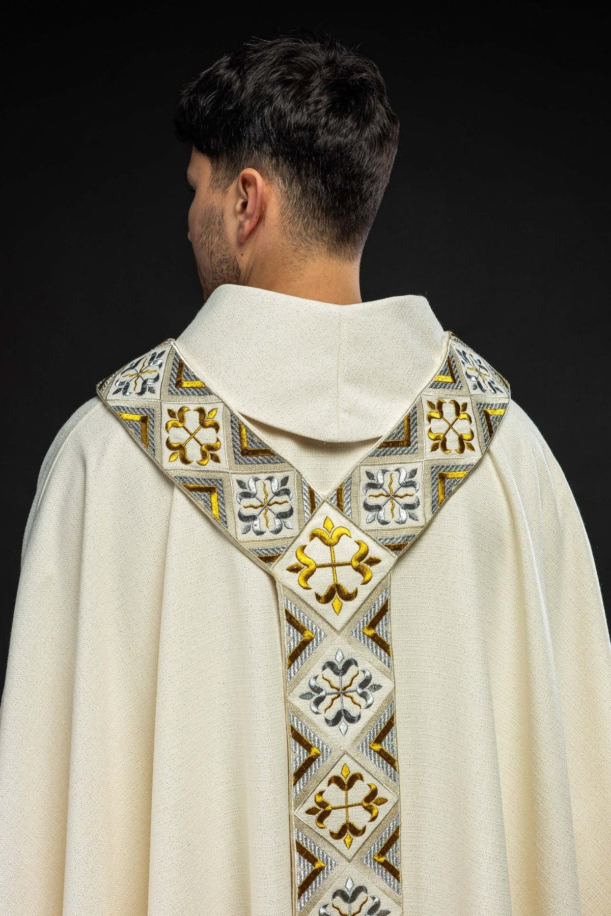 Cream chasuble set shown from the back with gold and silver embroidered orphrey
