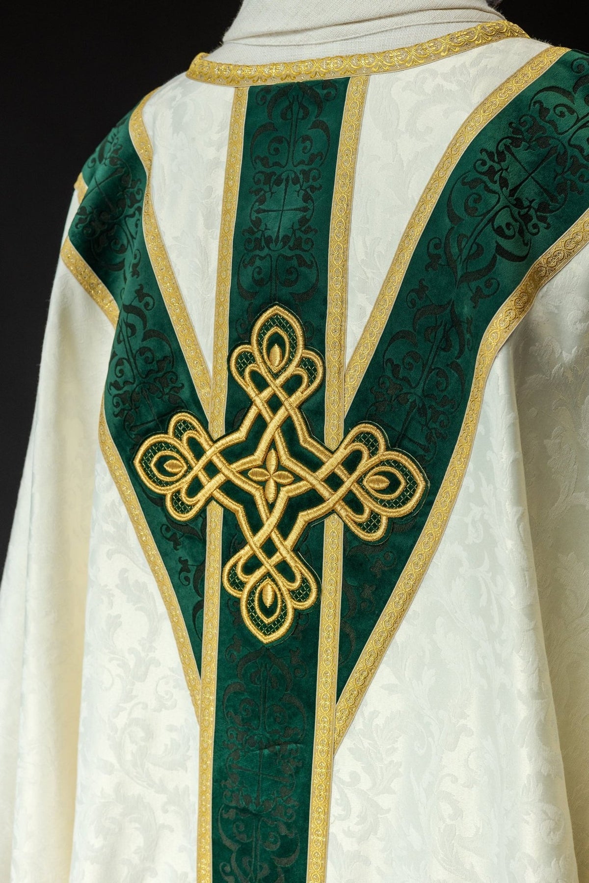 Chasuble detail with embroidered crosses and rows of gold tassel trim