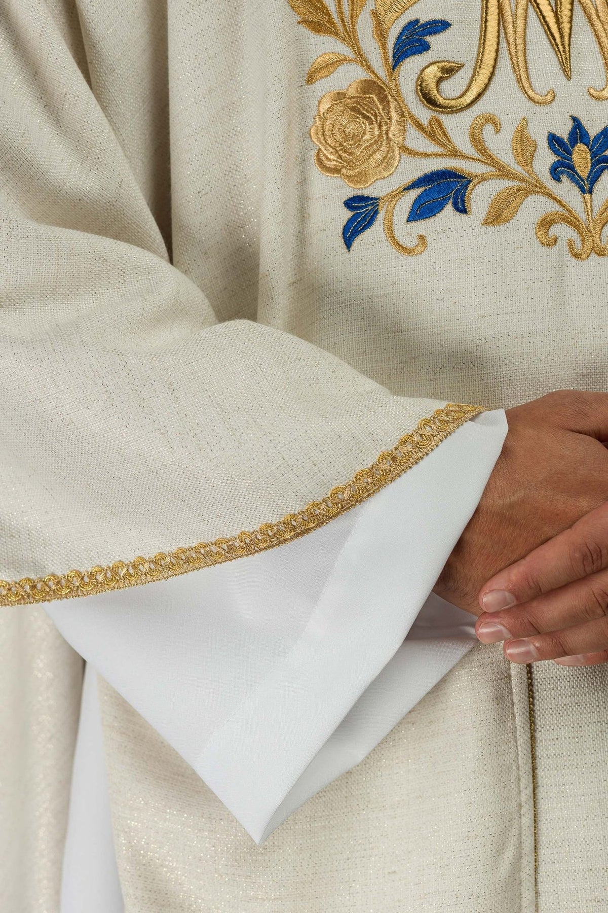 Ecru Marian chasuble close-up with gold and blue floral embroidery