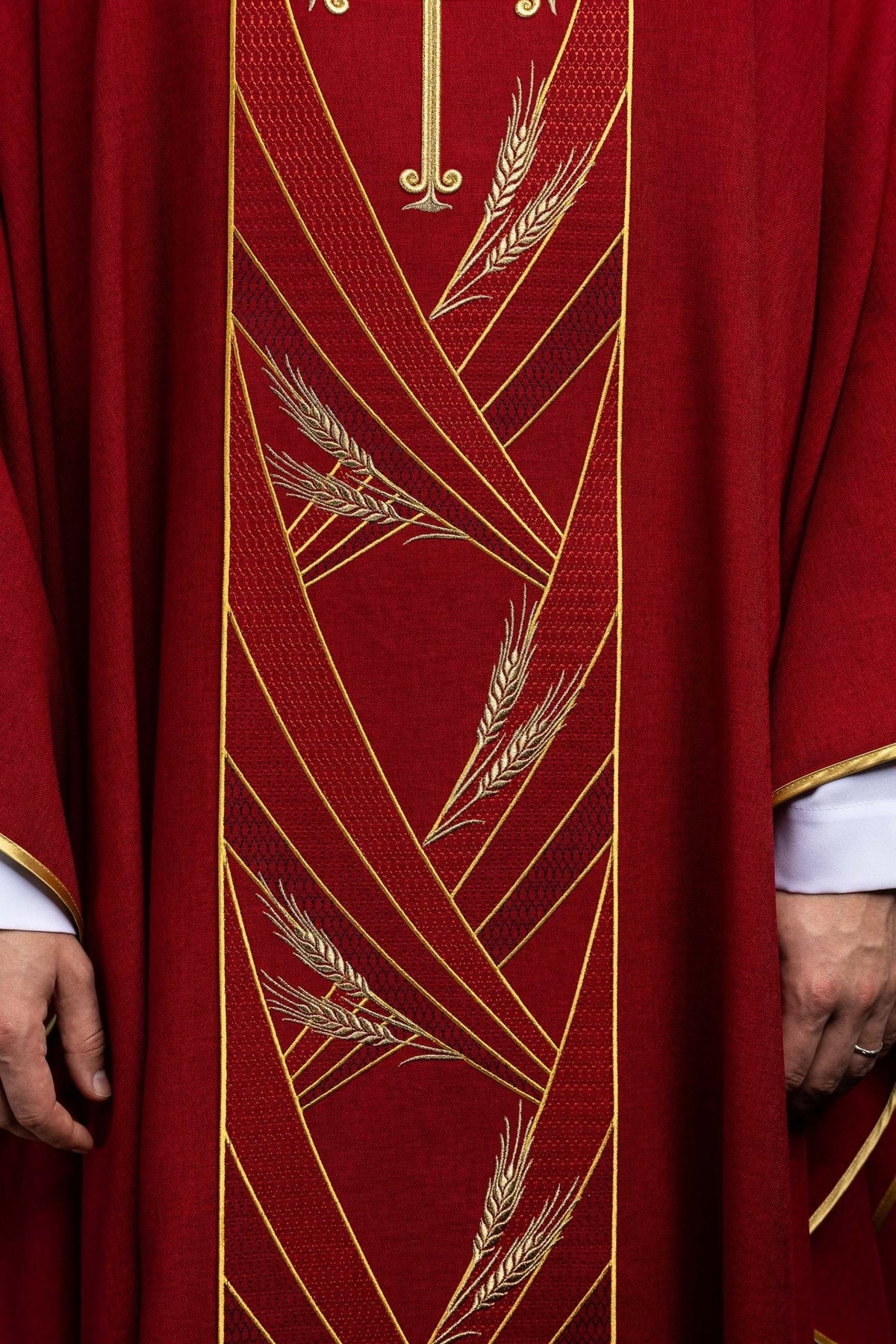 Red chasuble orphrey detail with gold wheat embroidery and diagonal trim