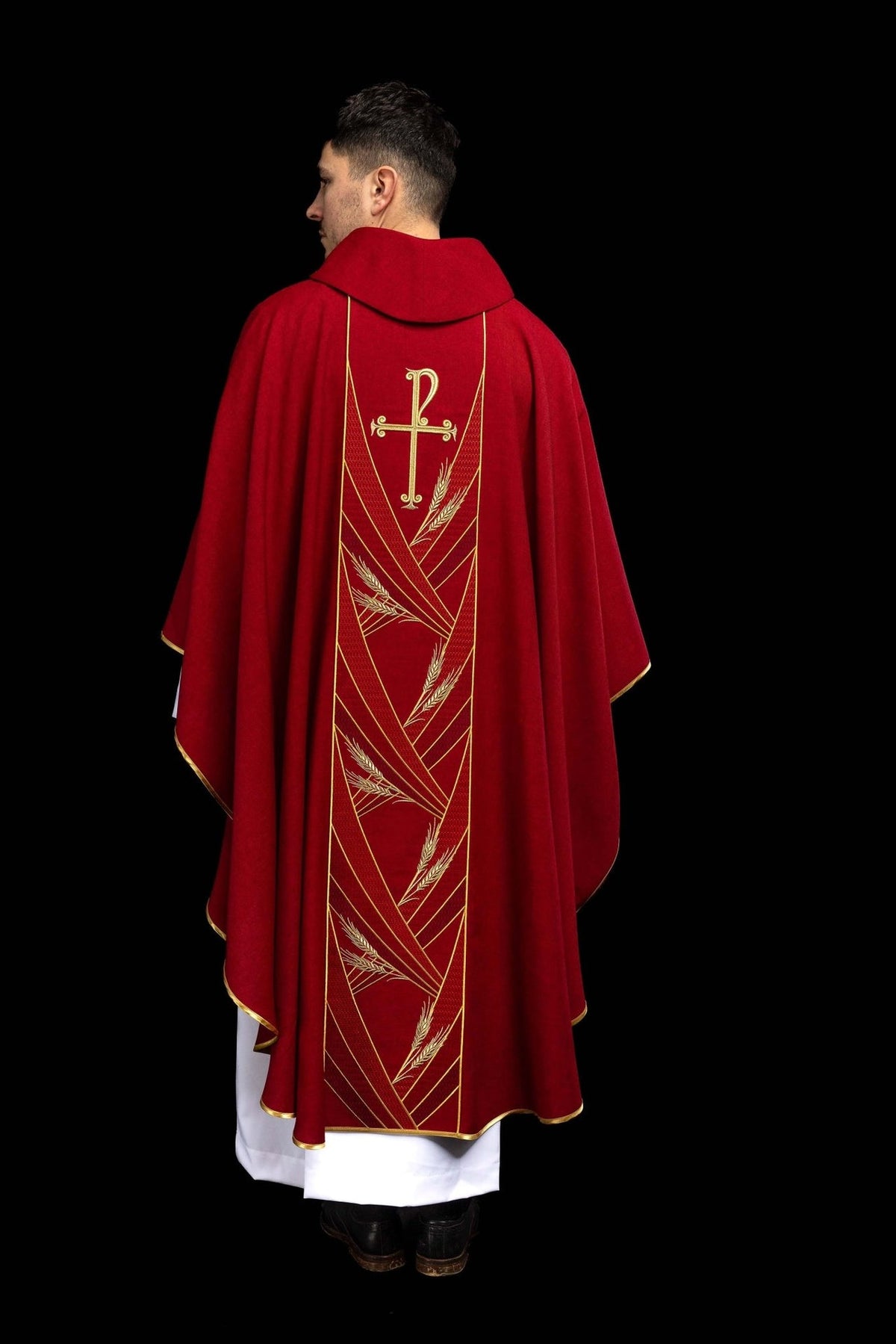 Red chasuble back close-up with gold cross and wheat embroidery