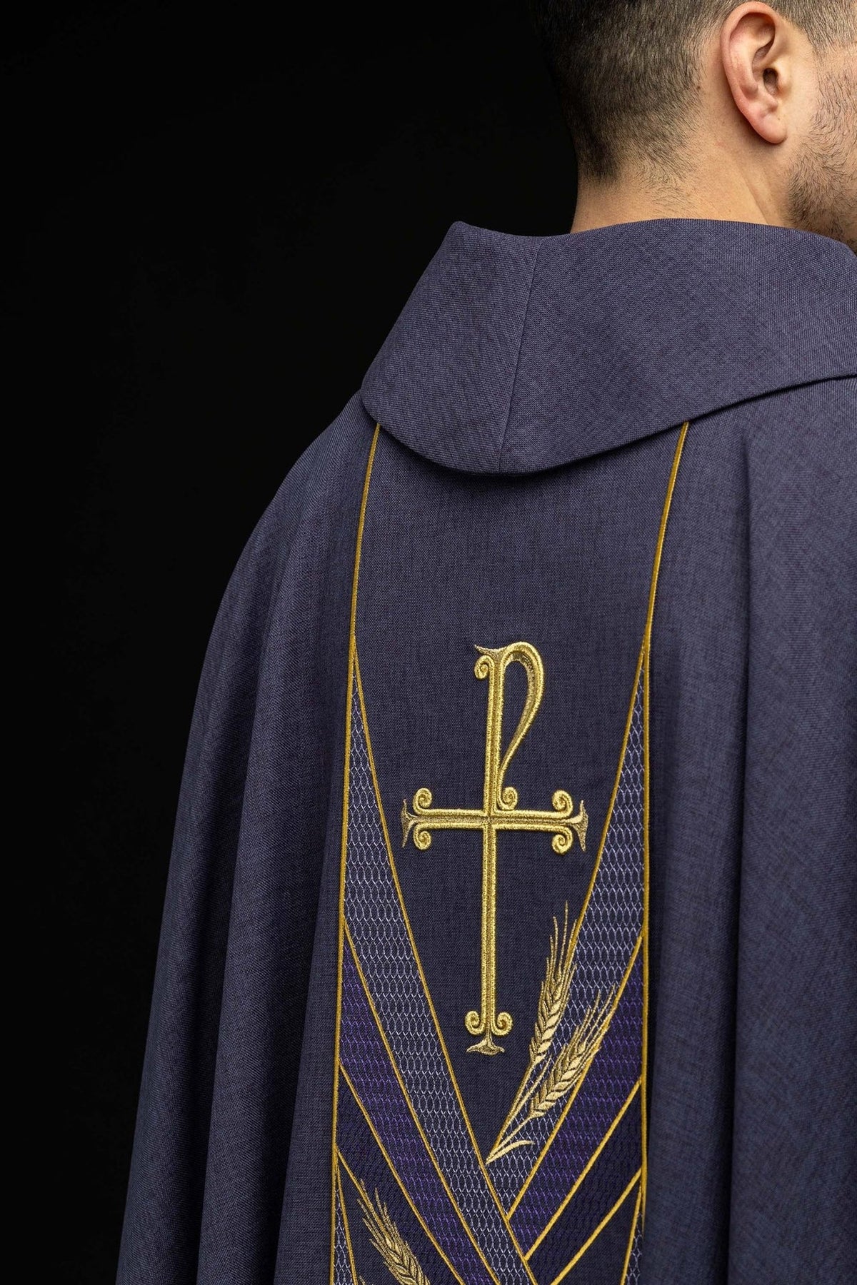 Purple chasuble side front view with stand-up collar and gold trim