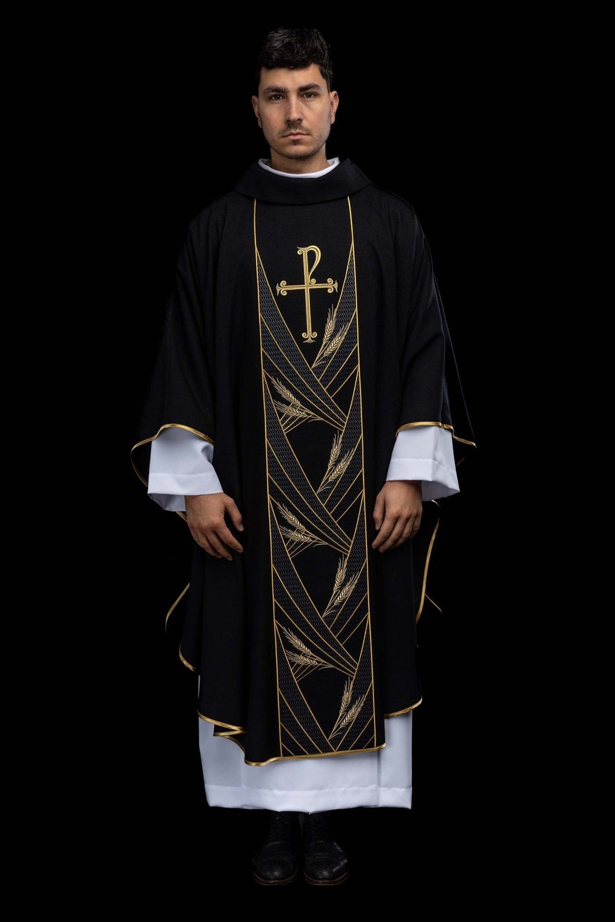 Black chasuble front view with gold PAX cross, wheat embroidery and gold trim