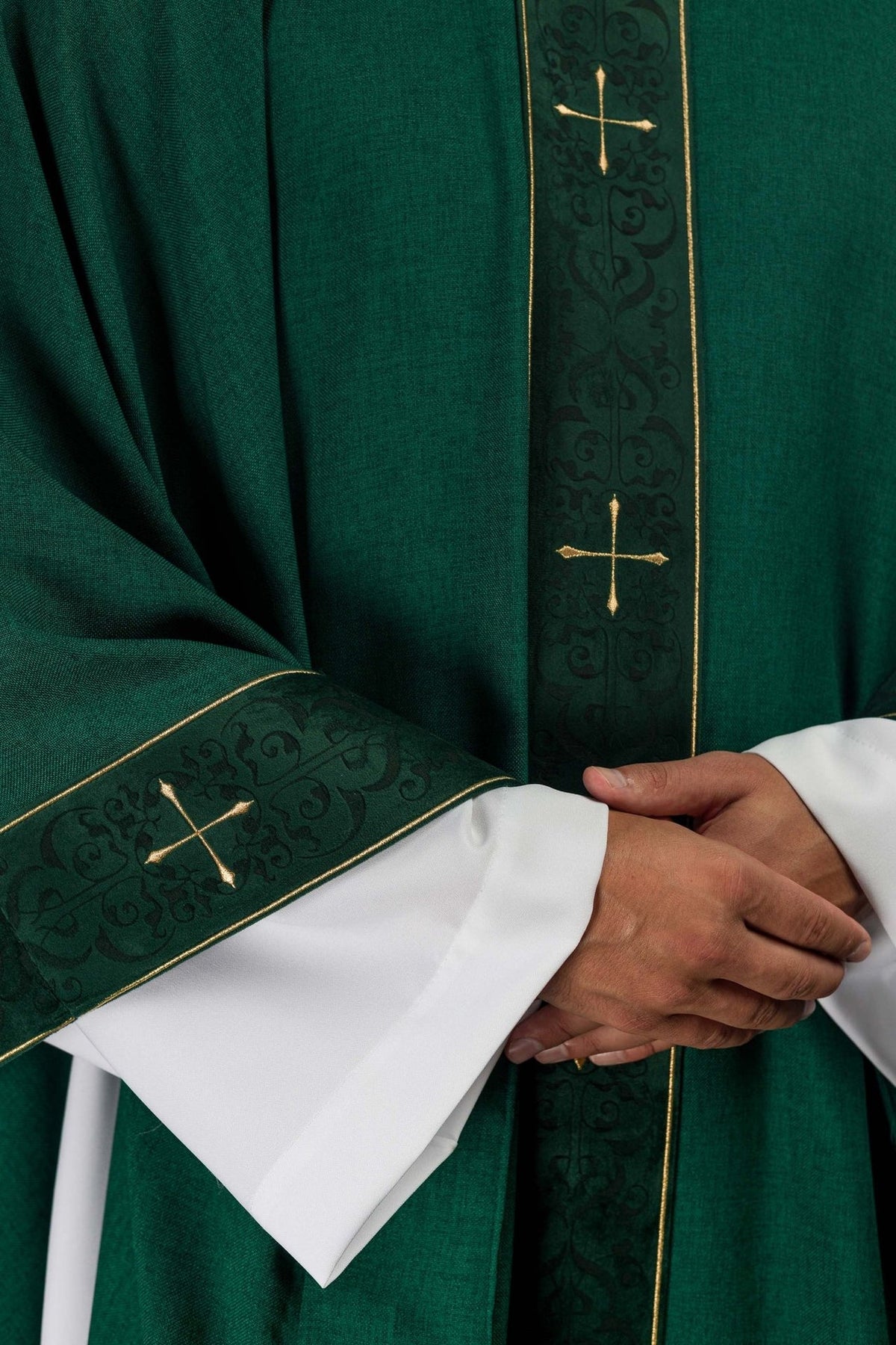 Green chasuble close-up of embroidered orphrey and sleeve cross