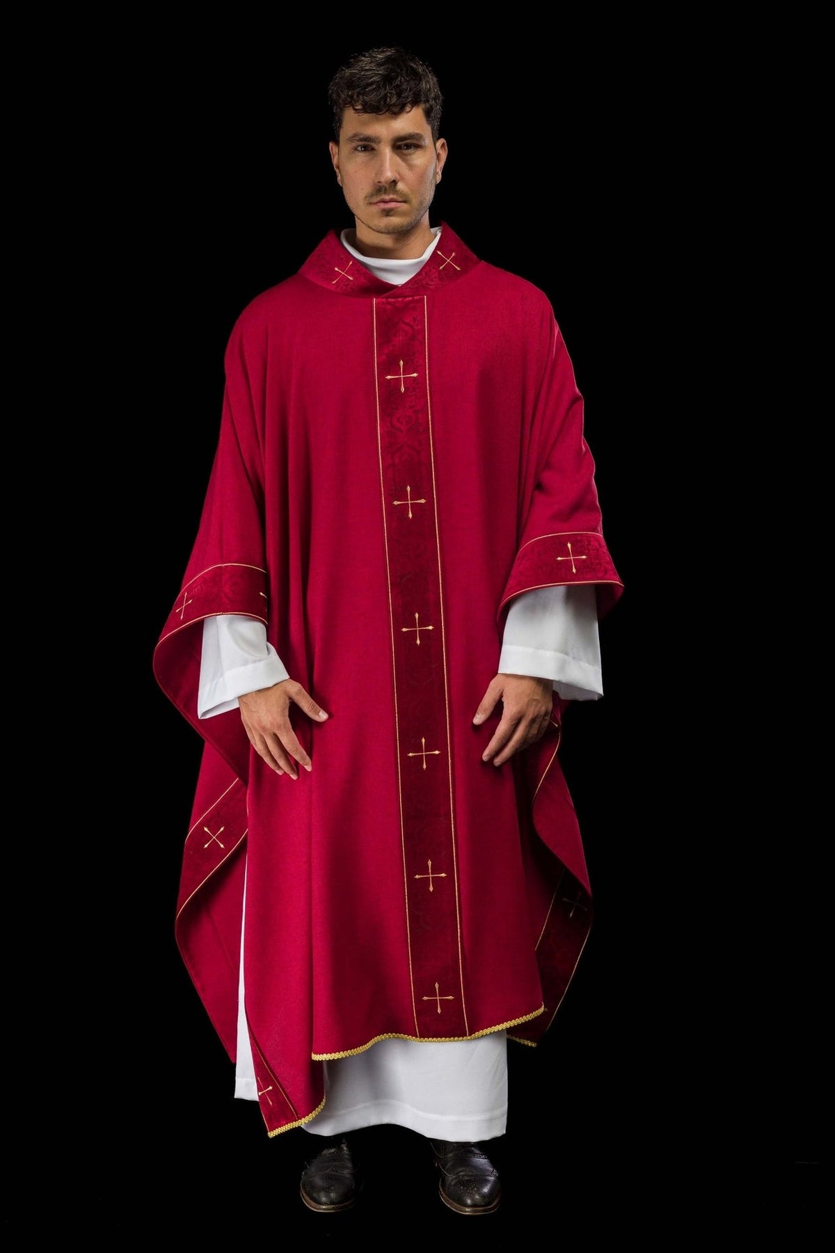 Red chasuble front view with gold cross embroidery and decorated cuffs