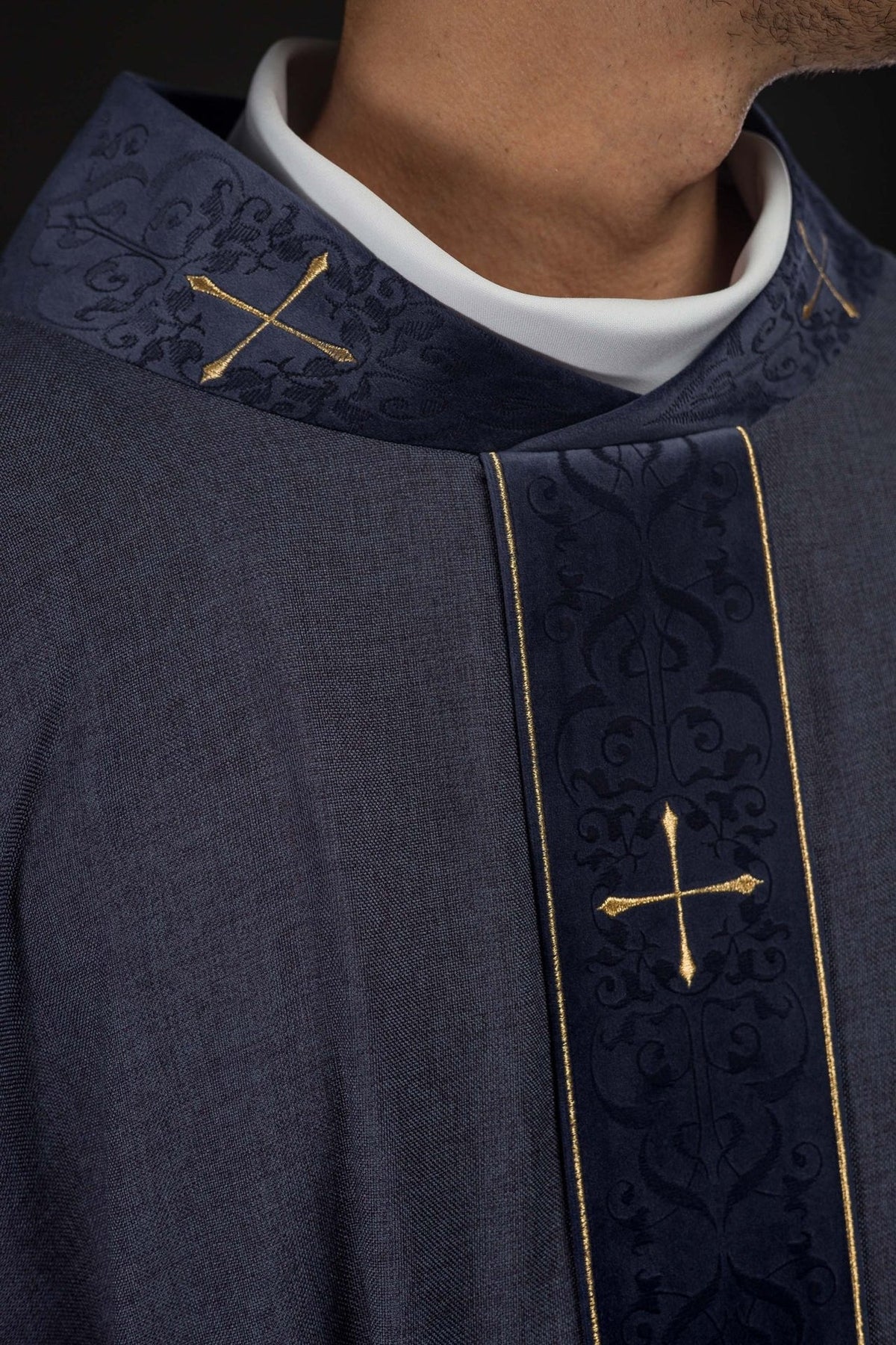 Purple chasuble close-up of cross-motif collar and embroidered front orphrey