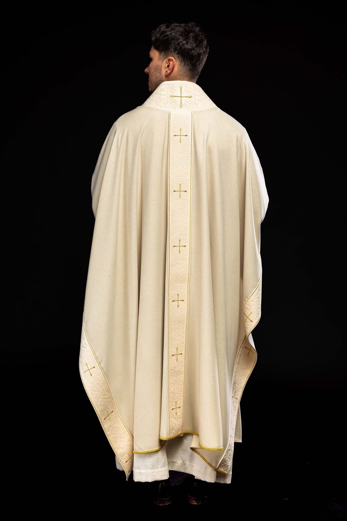 Ecru chasuble back view with embroidered orphrey, gold crosses and decorated sleeve edges