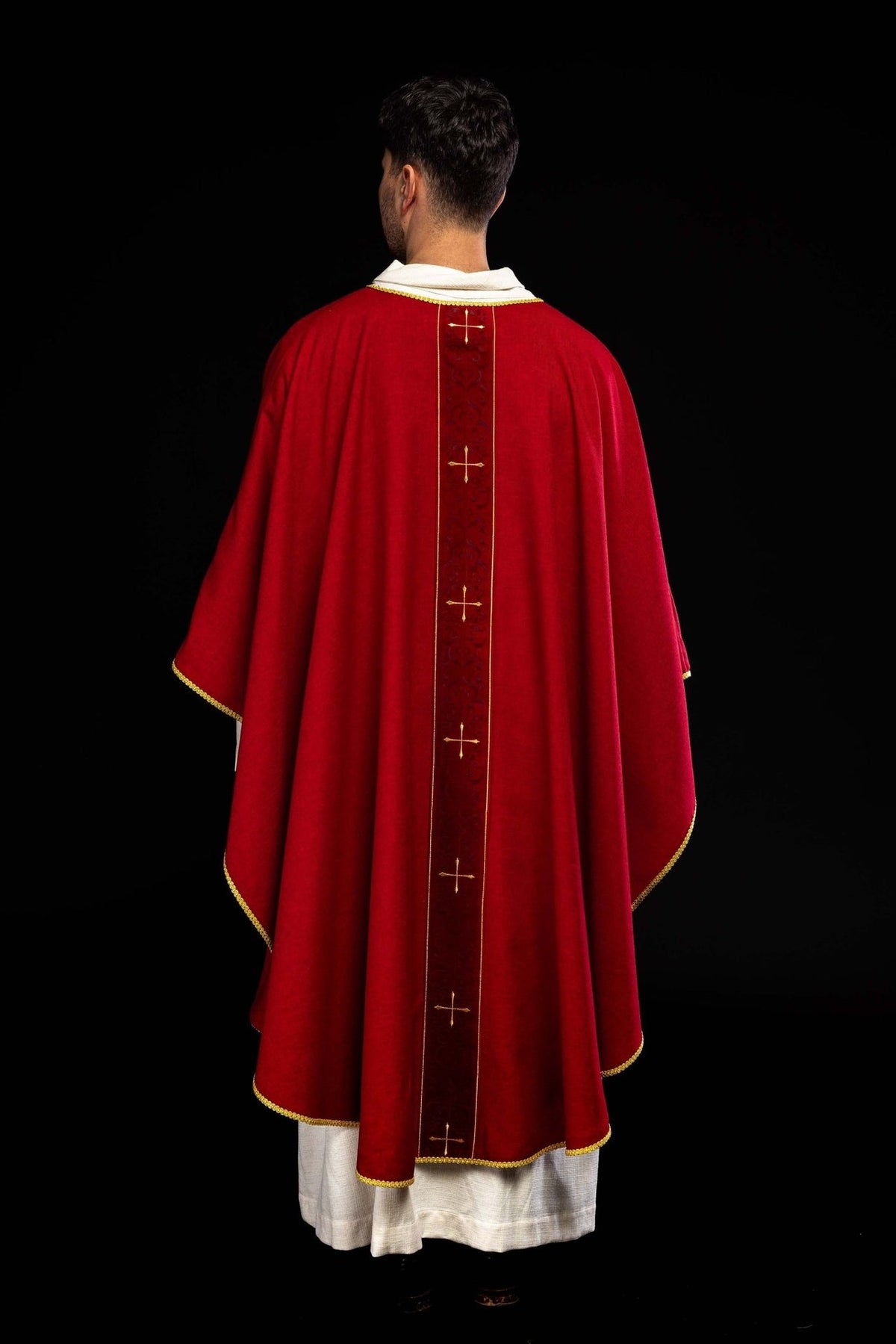 Red chasuble back view with embroidered orphrey and gold crosses