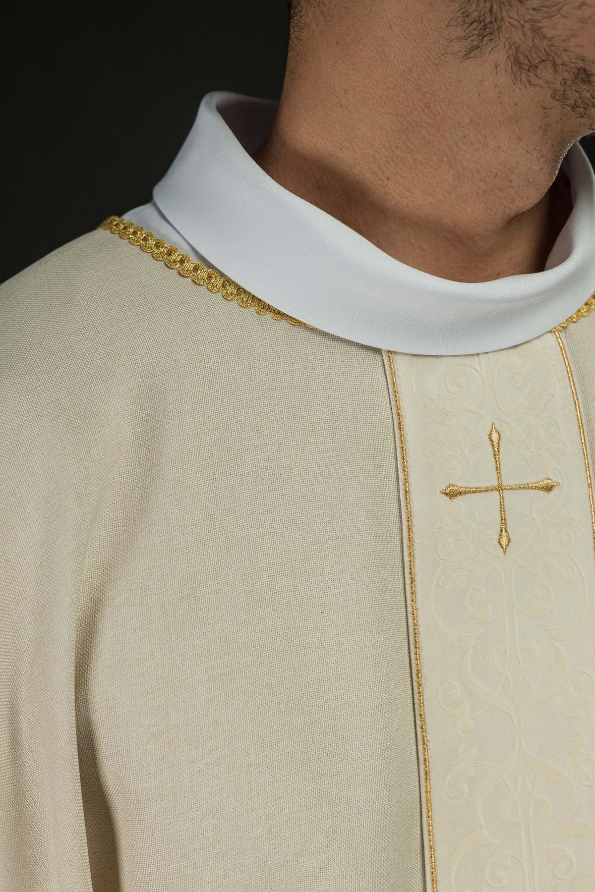 Ecru chasuble close-up of collar, orphrey and gold cross