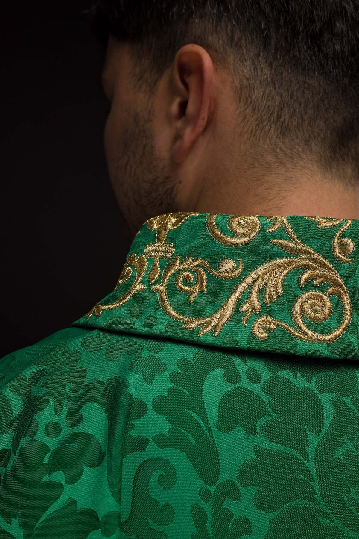 Green chasuble close-up of the gold embroidered collar from the back