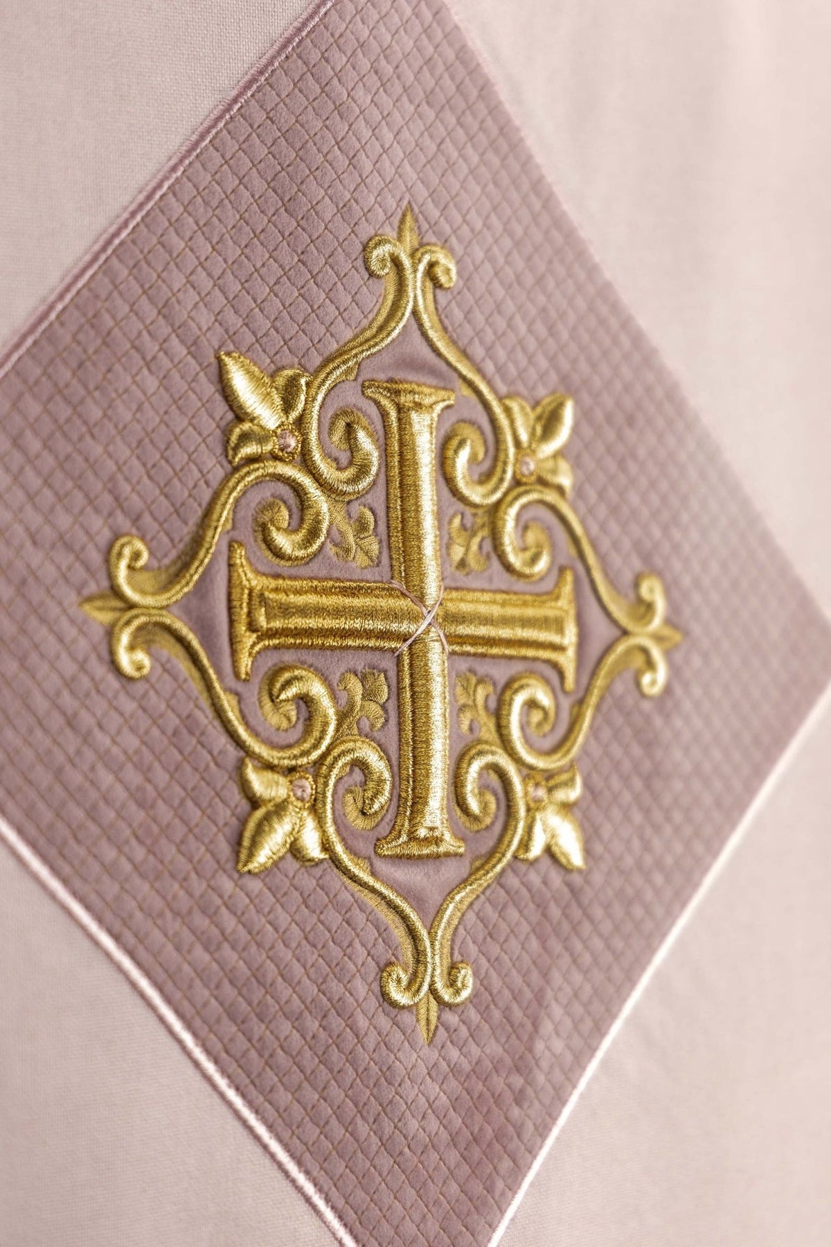 Rose church lectern cover close-up of embroidered gold cross