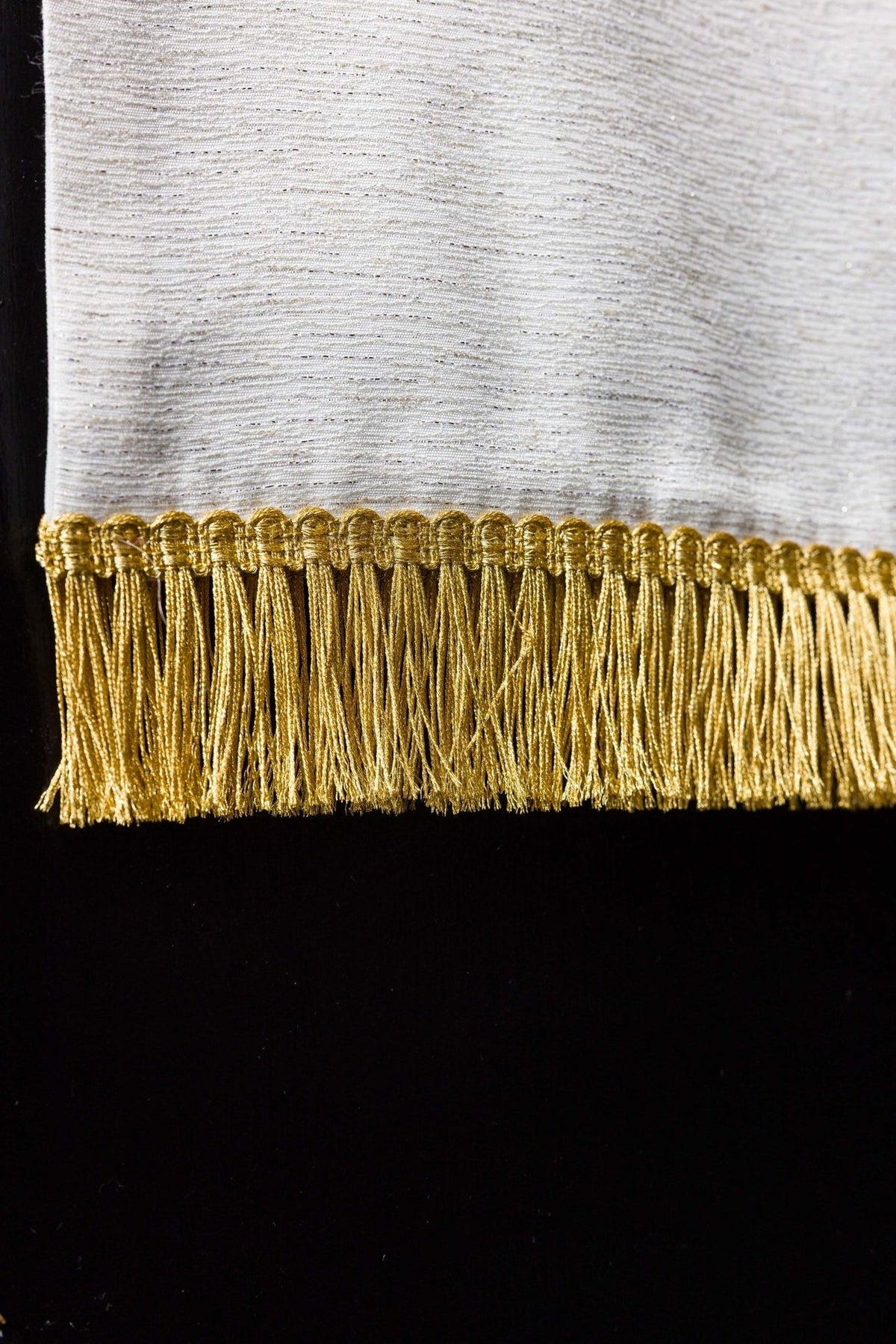 Church lectern cover close-up of gold fringe on the lower edge