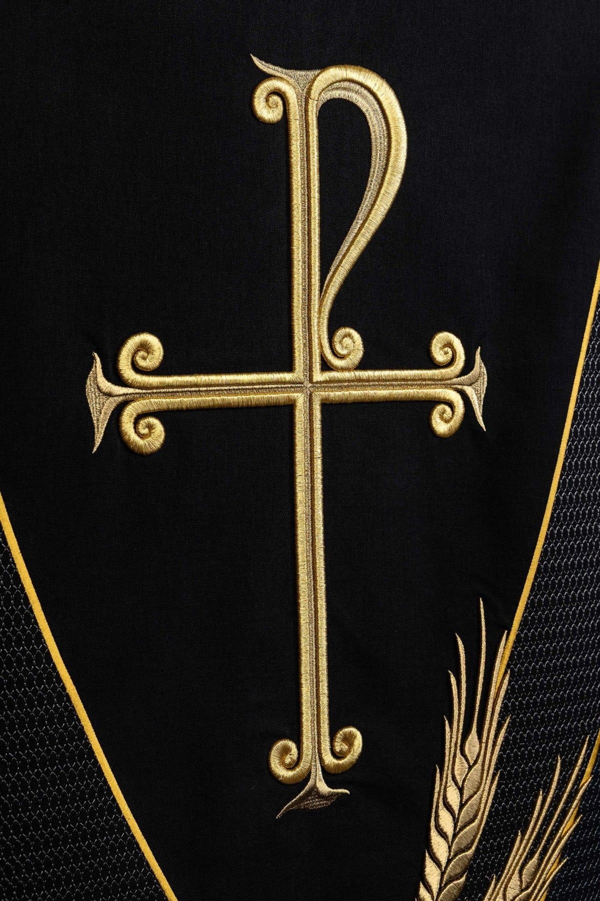 Black church lectern cover close-up of gold cross embroidery