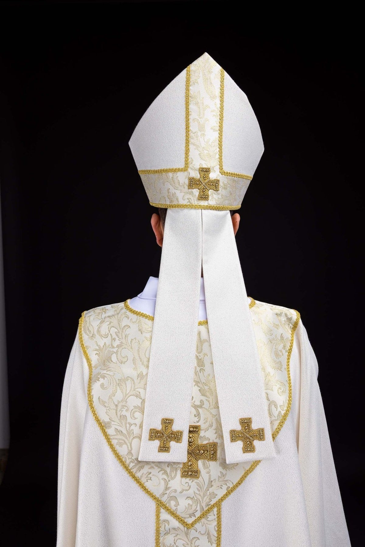 Ecru miter back view with jacquard fabric and gold embroidered cross