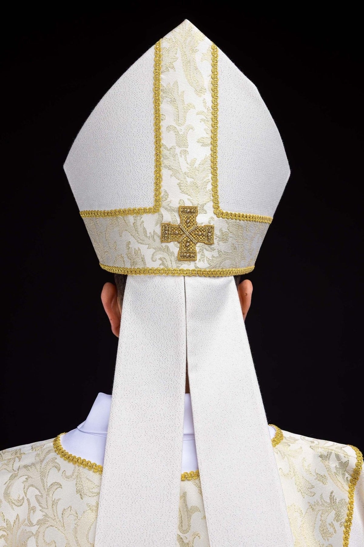 Ecru miter front view with embroidered cross and central jacquard panel