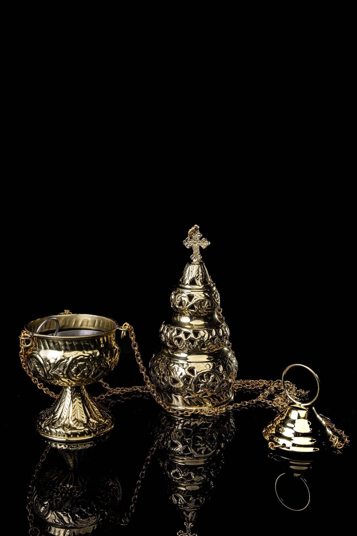 Brass thurible open, showing the bowl, ornate lid, chains and bell