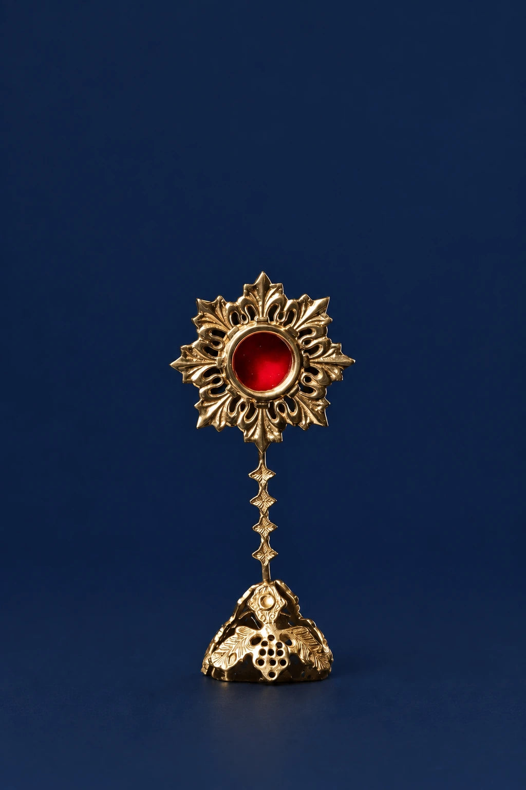 Brass Reliquary with Sunburst Motif, 7.75 in (20 cm), full front view with red center and decorated base