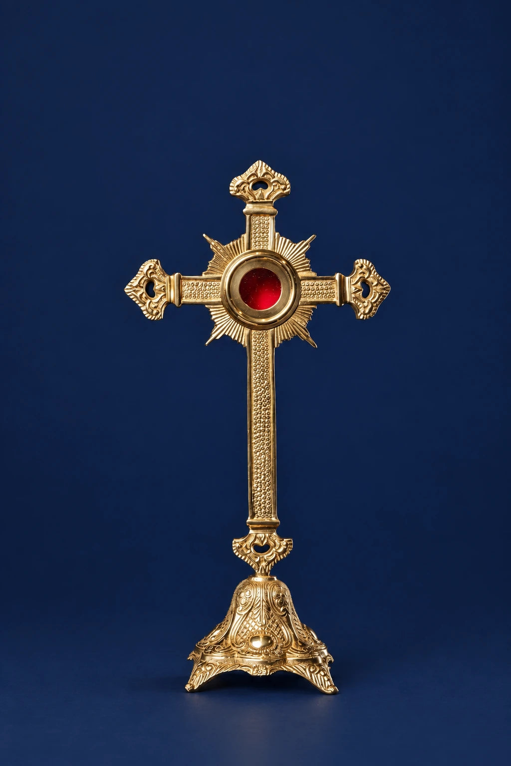 Brass Reliquary Shaped as an Ornate Cross, 16 in (41 cm) High, front view with red center