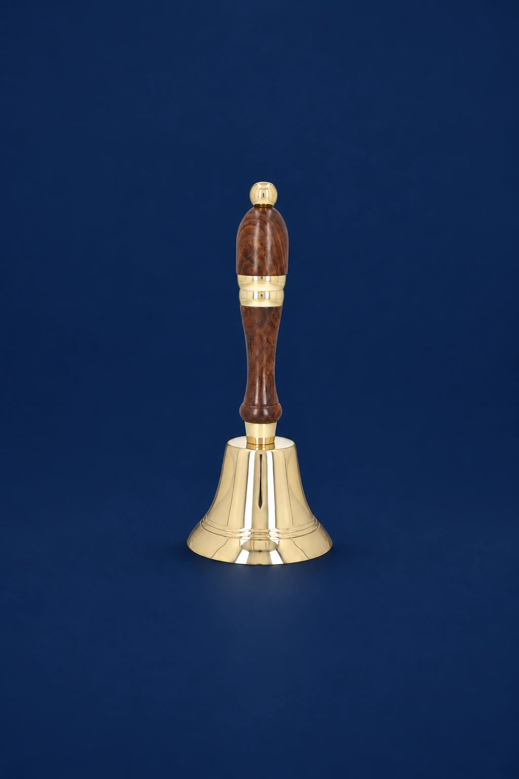 Brass Altar Bell with Wooden Handle, 8.25 in (21 cm), front view with polished brass bell and brown handle