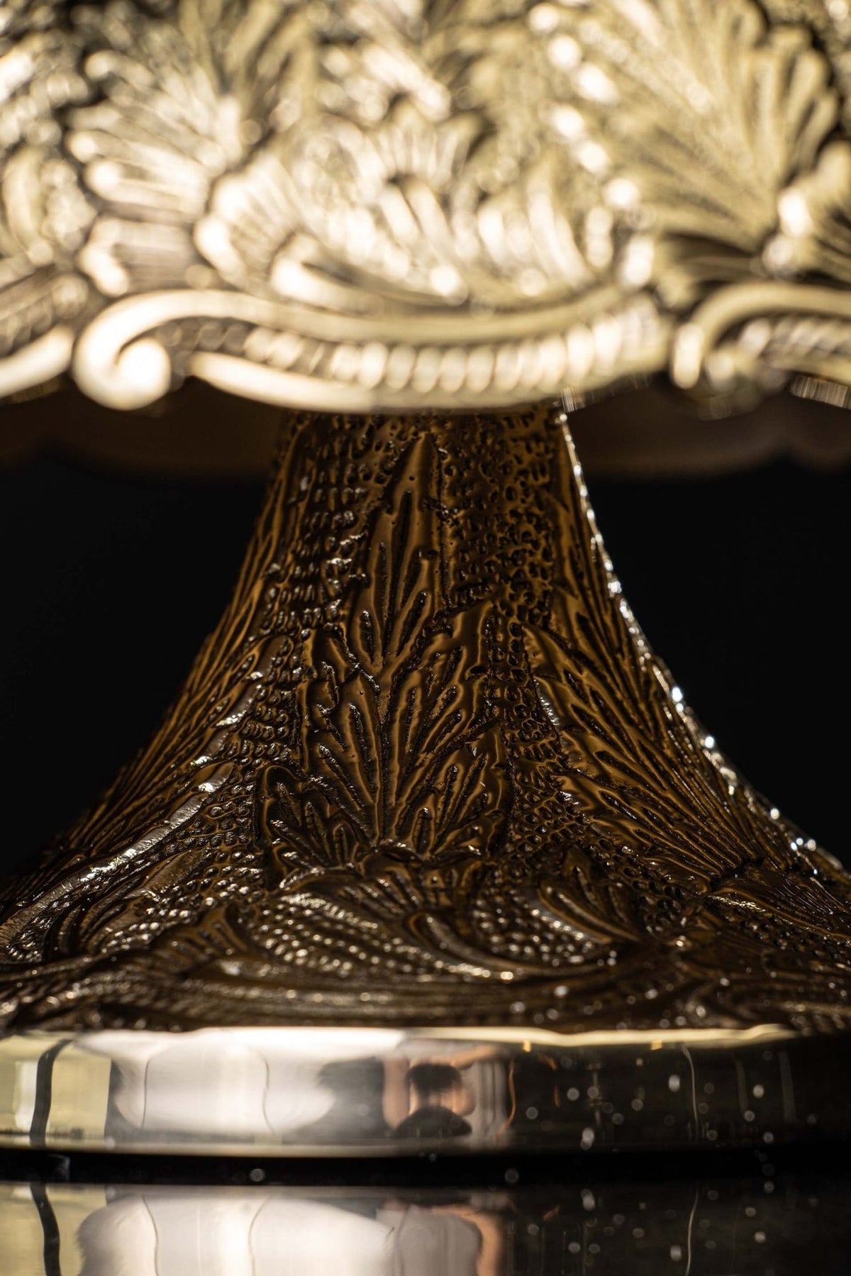 Brass altar bells, close-up of cross above the engraved dome