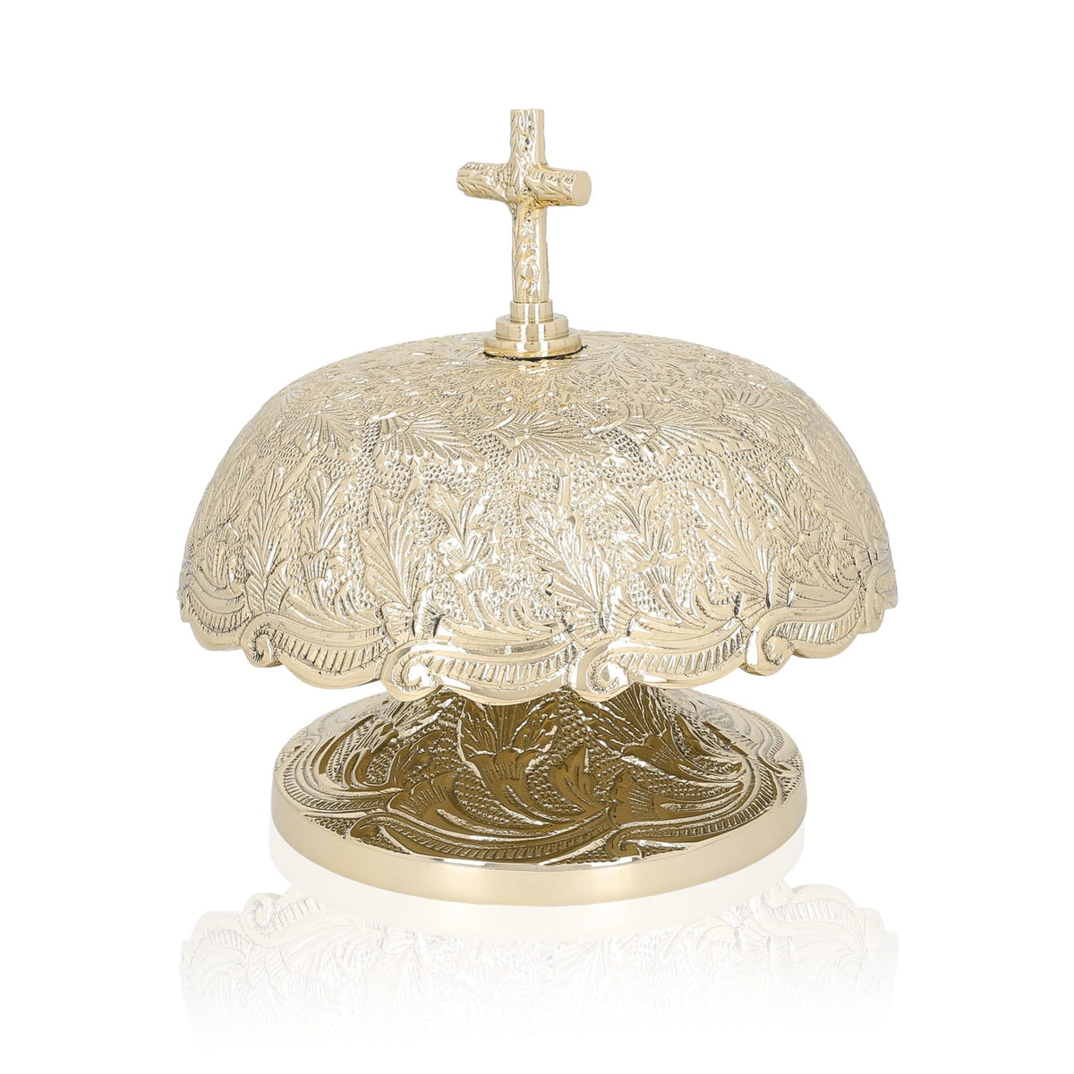 Brass altar bells, angled view showing engraved dome and decorative base