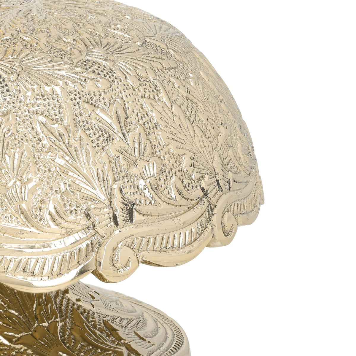 Brass altar bells, close-up of floral engraving and scalloped dome edge