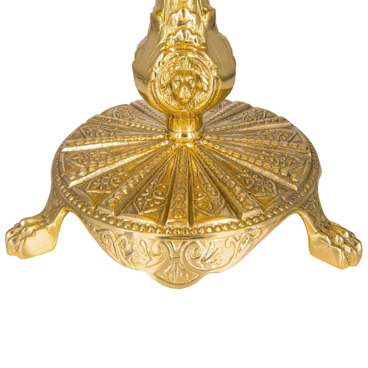Thabor table close-up showing ornate brass base with radial relief and scrollwork