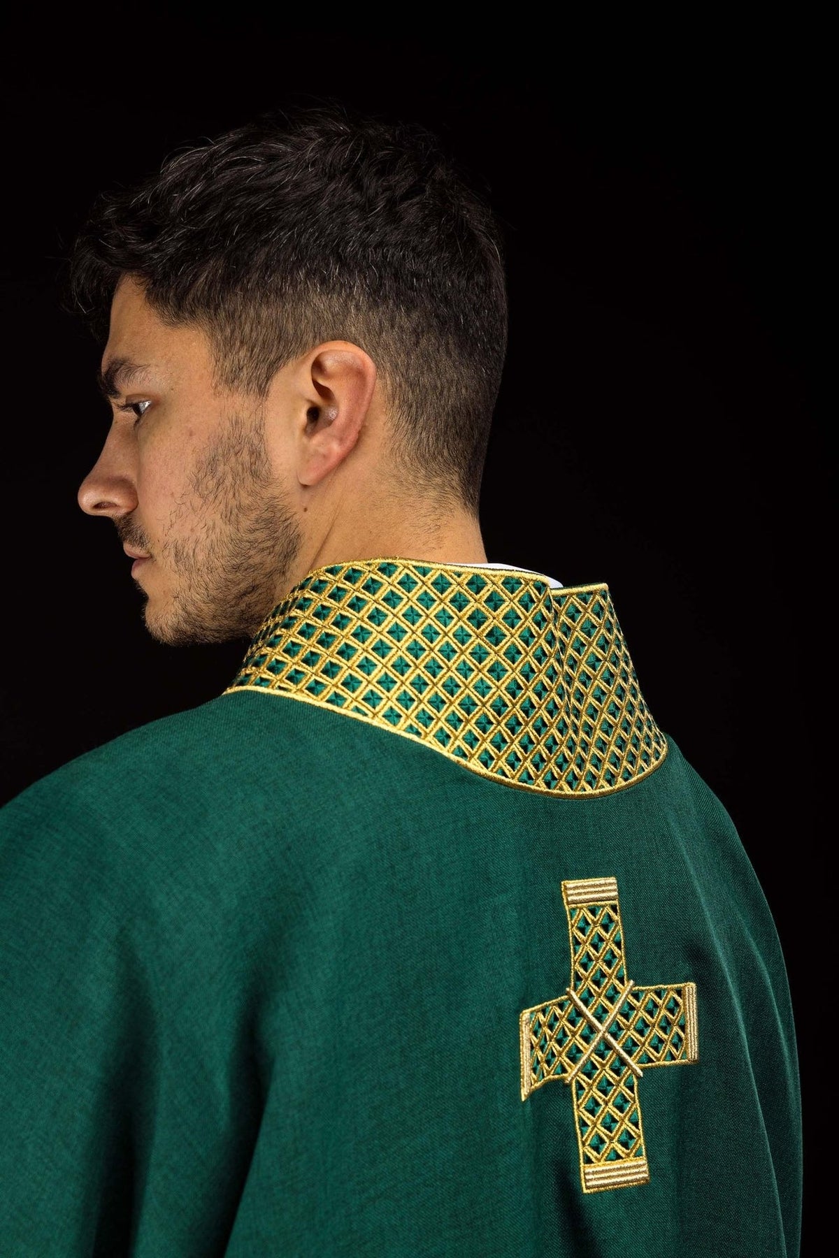 Green dalmatic side back view showing embroidered collar and cross