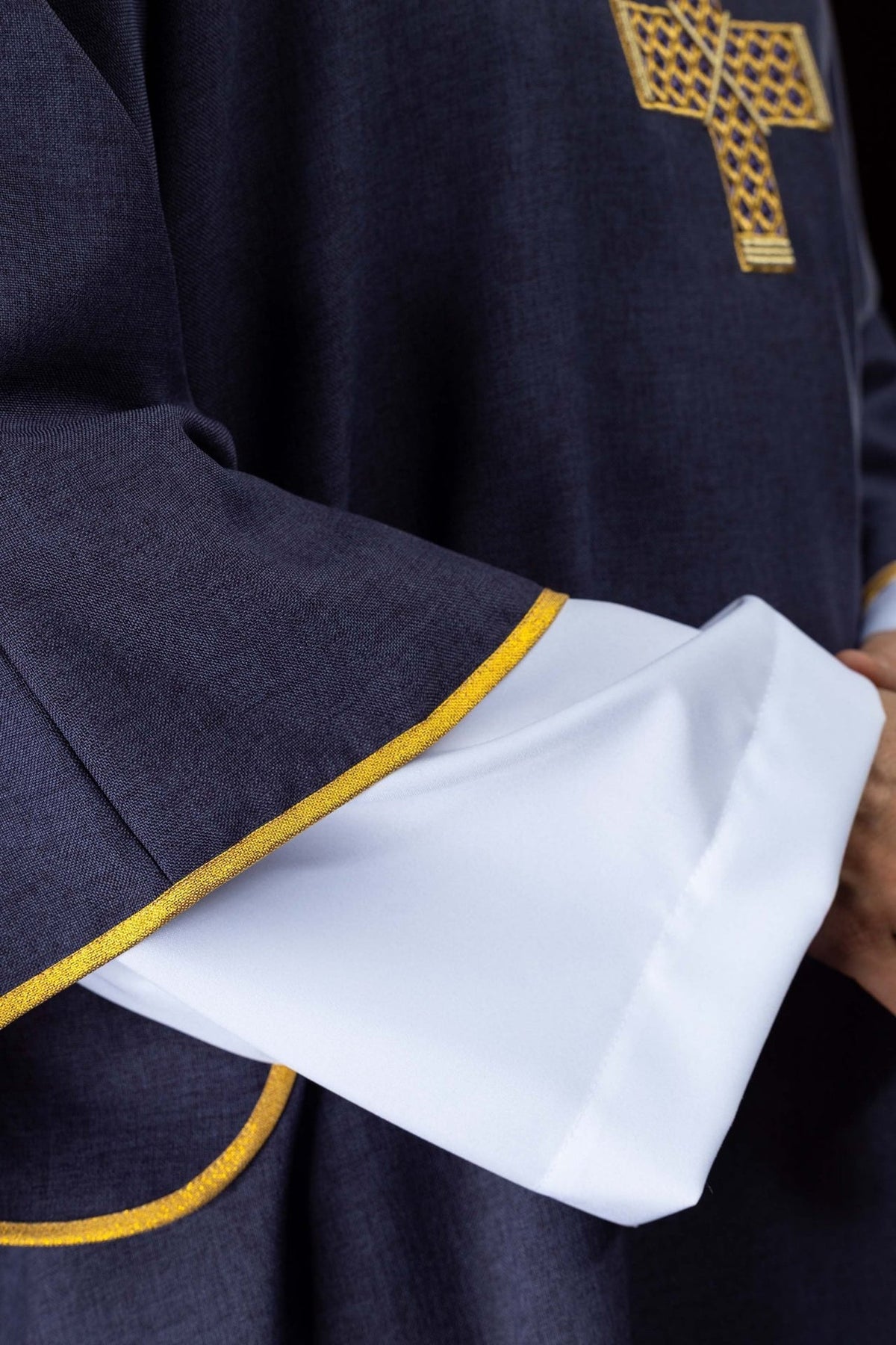 Purple dalmatic sleeve close-up with gold trim