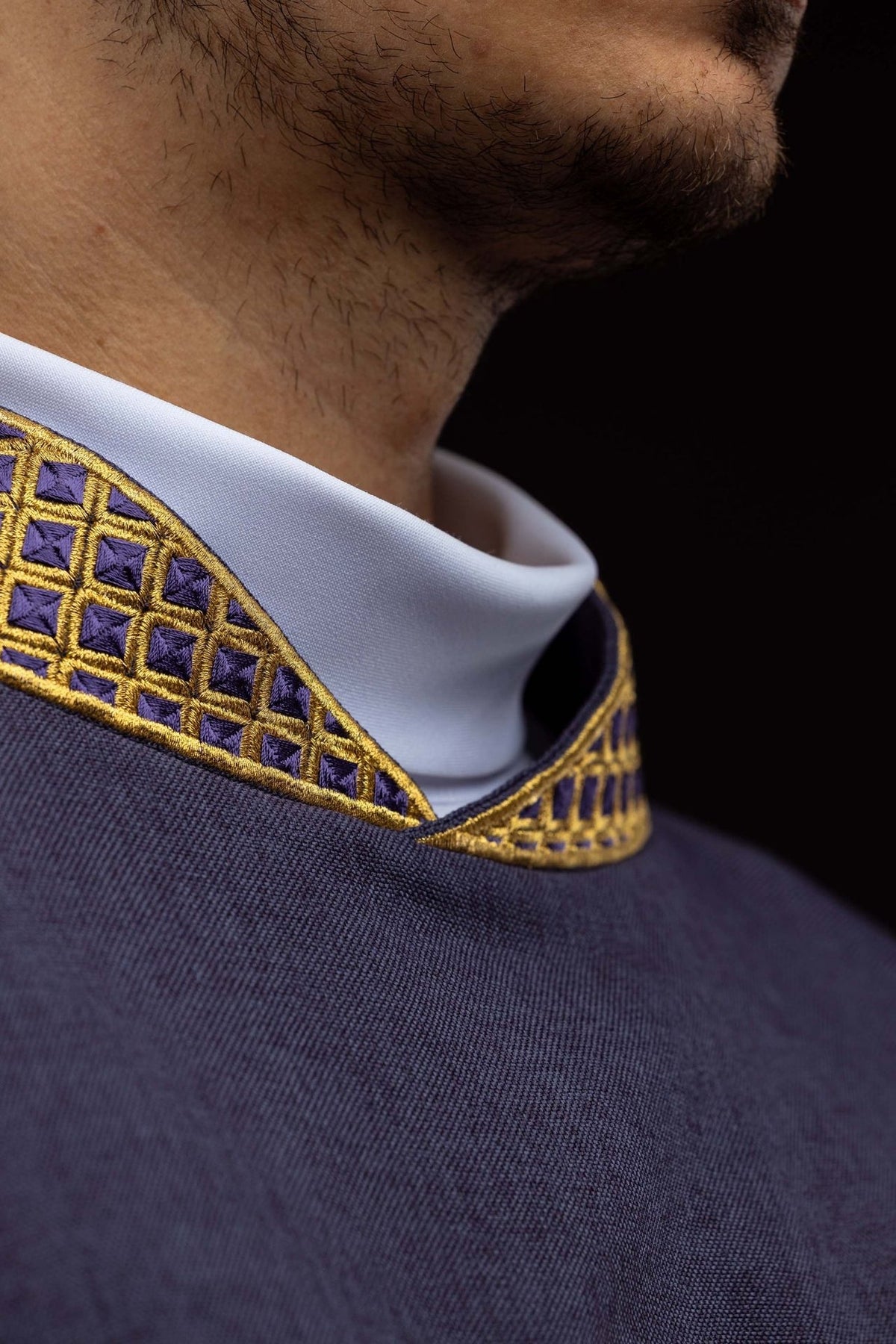 Purple dalmatic gold cross embroidery close-up