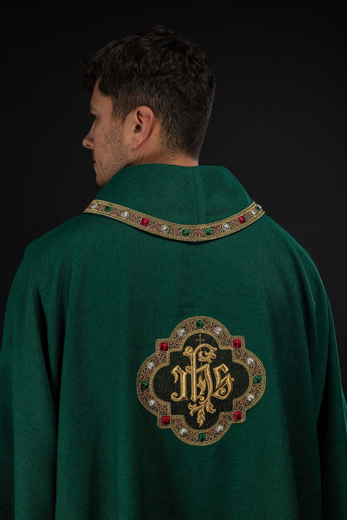 Green dalmatic, back view with embroidered IHS symbol and decorative collar trim