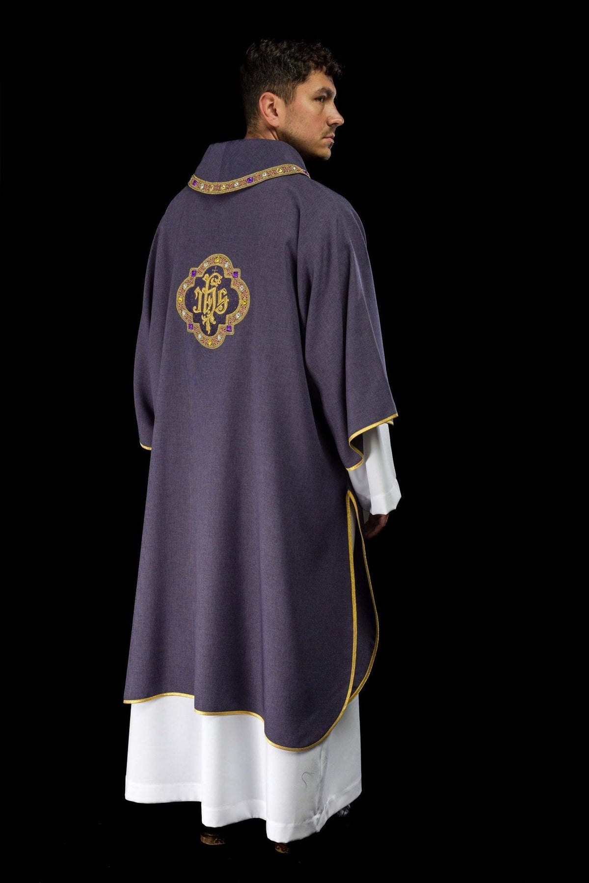Purple dalmatic three-quarter back view with embroidered IHS symbol and gold trim