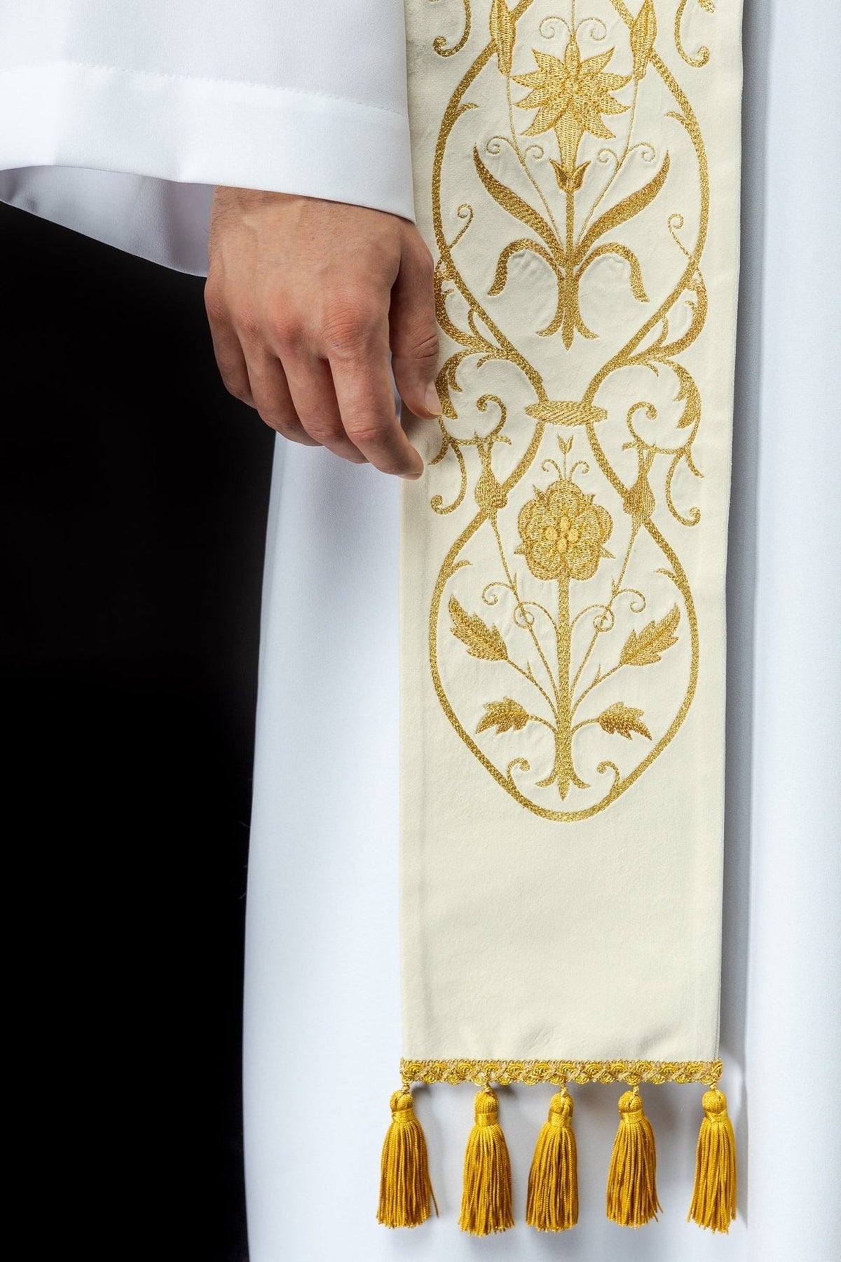 Stole close-up showing gold floral embroidery and decorative tassels