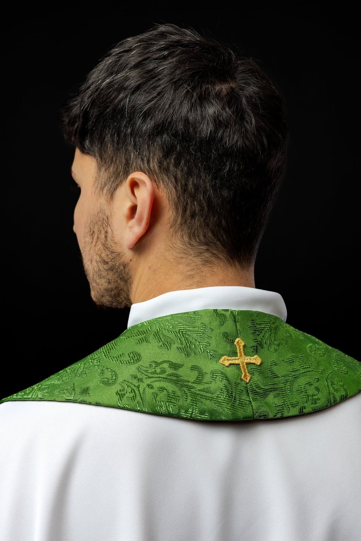 Green embroidered jacquard stole, back view with a single gold cross