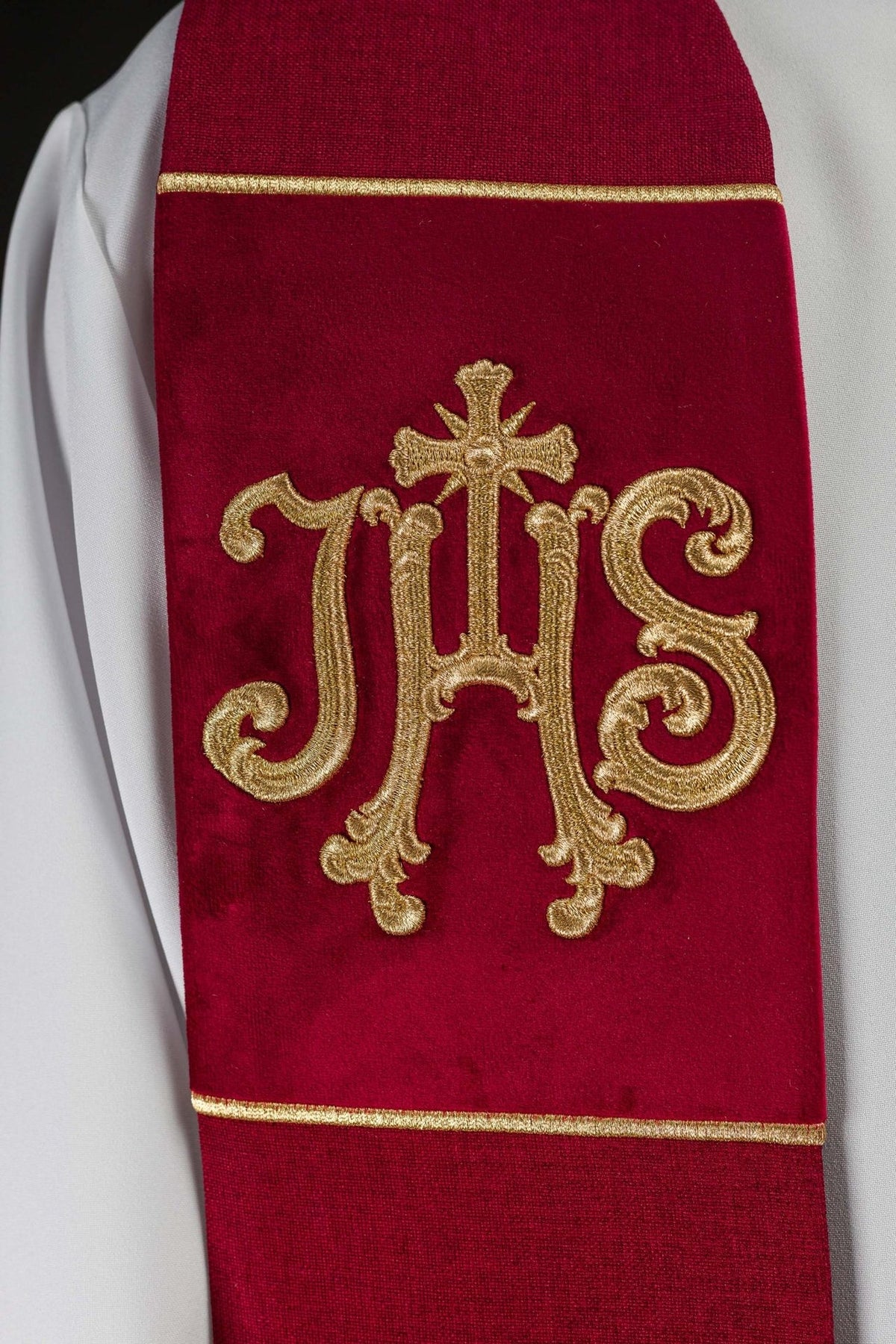 Red velvet stole, close-up of gold embroidered IHS motif