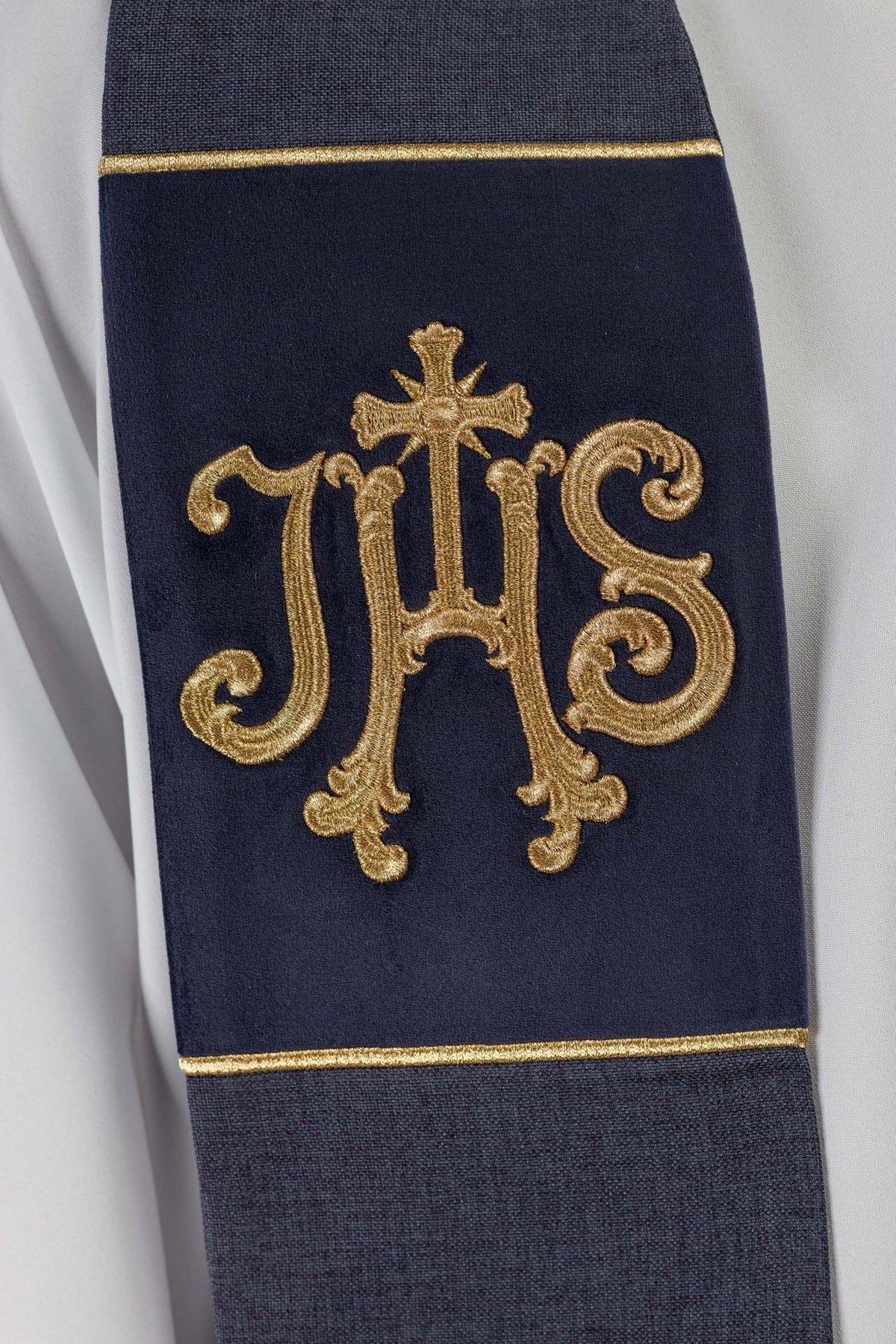 Purple velvet stole close-up with embroidered gold IHS motif and velvet texture