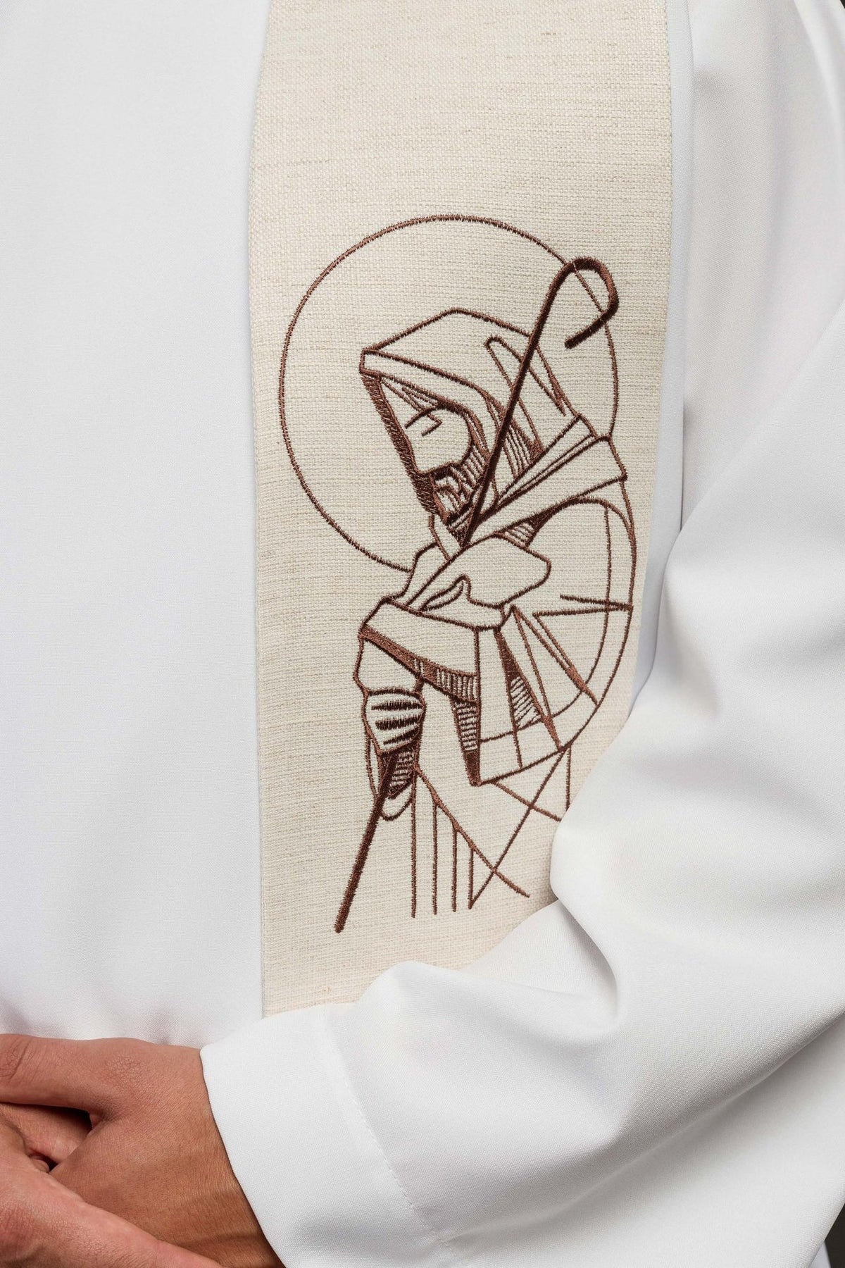 Ecru stole close-up showing embroidered Good Shepherd motif