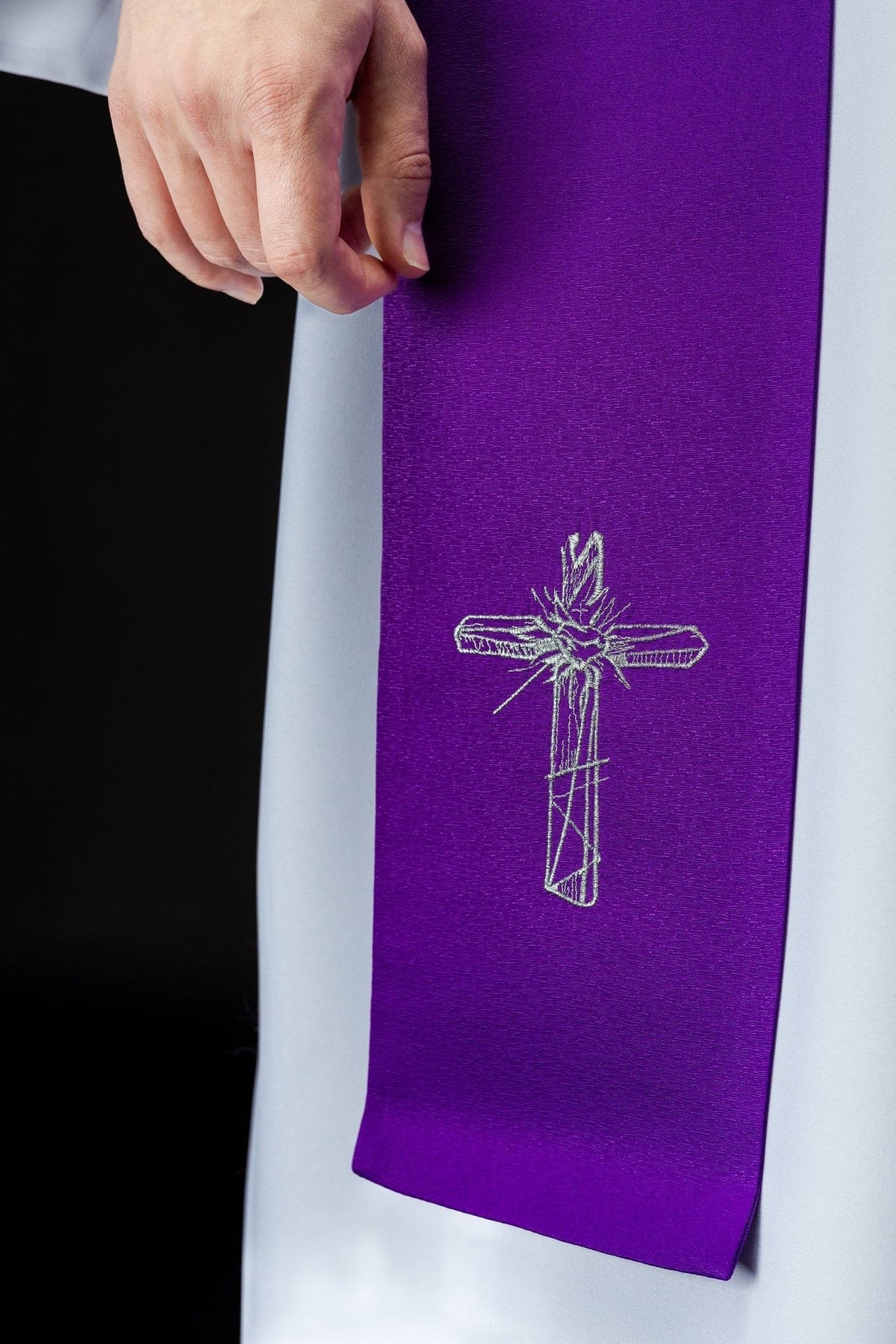 Purple Lent stole close-up with silver embroidered cross motif