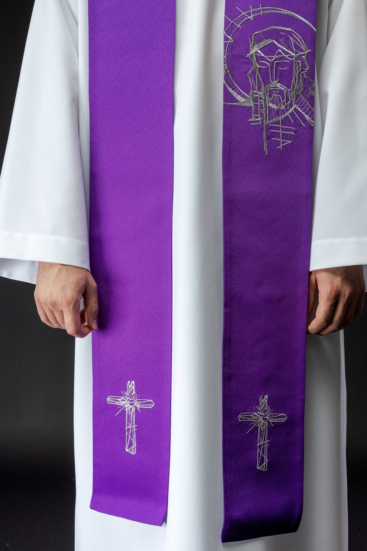 Embroidered Lent stole worn front view with Jesus and cross embroidery in silver