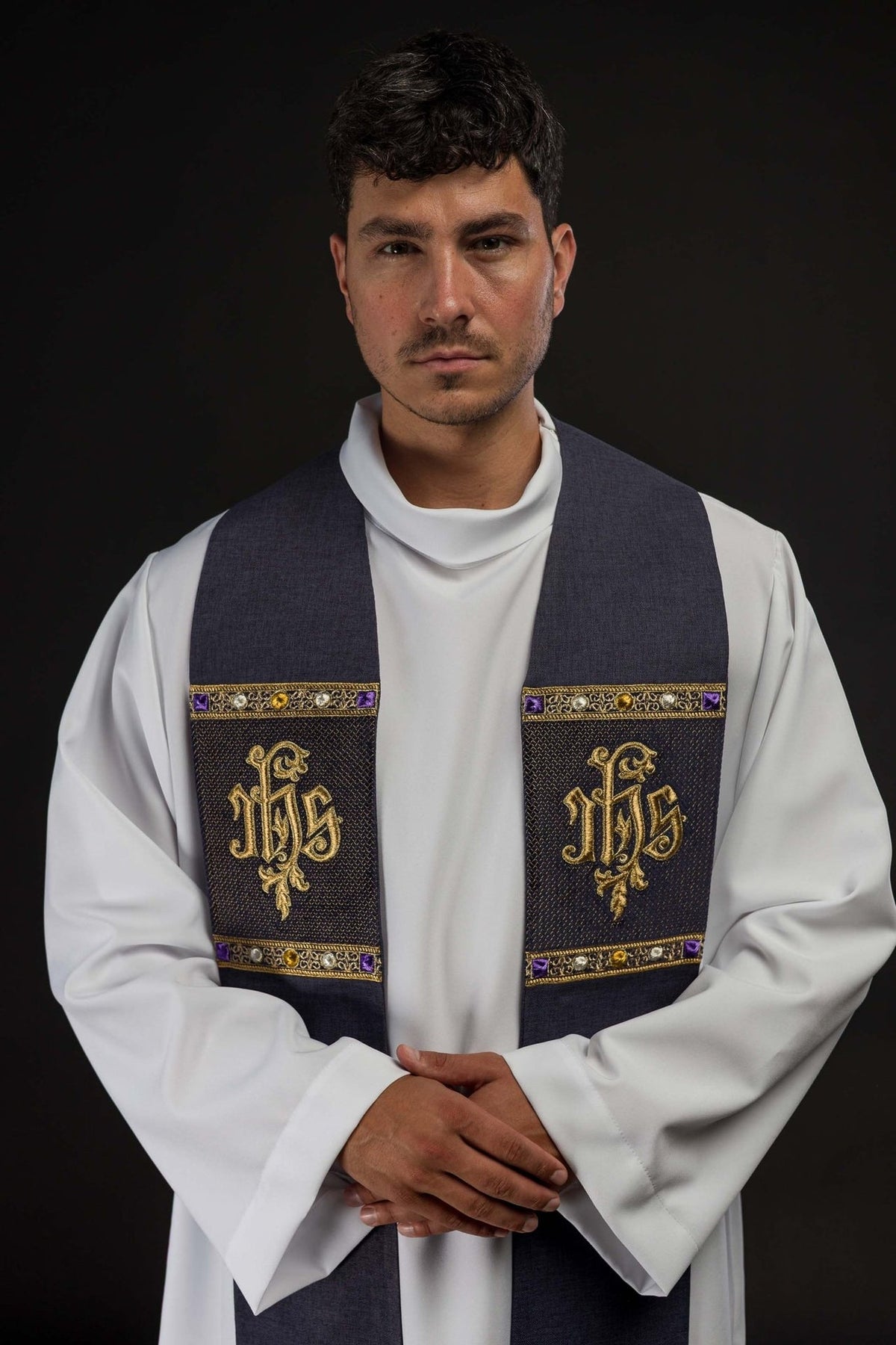 Purple priest stole worn front view with gold IHS embroidery and decorative bands