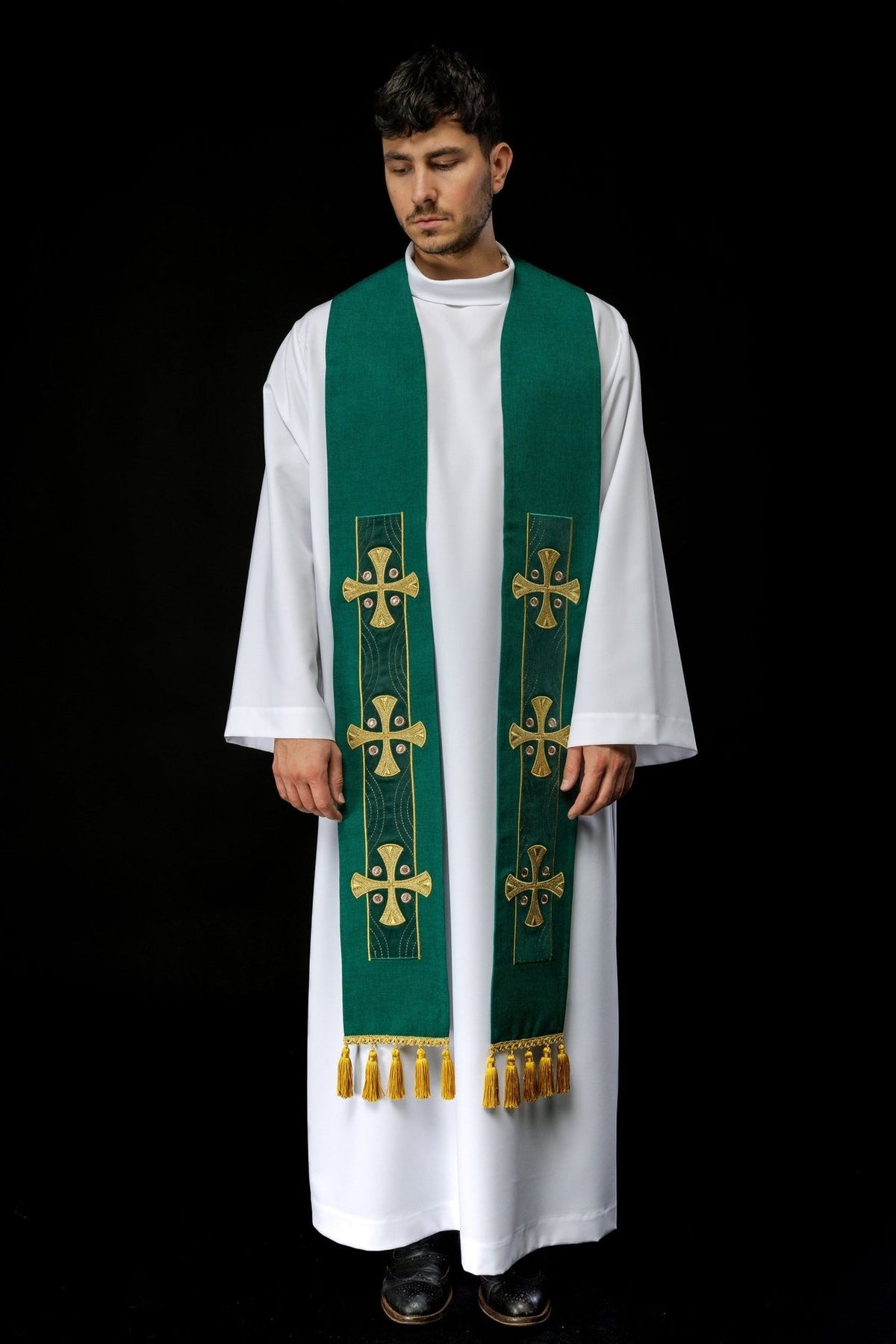 Green stole full front view showing repeated cross embroidery and gold tassels