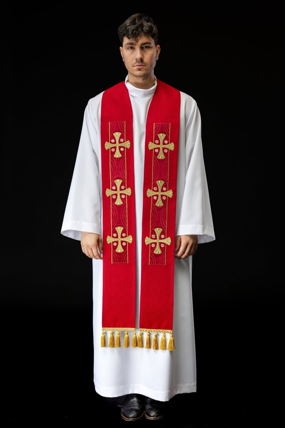 Red stole worn front view with three gold embroidered crosses and tassels