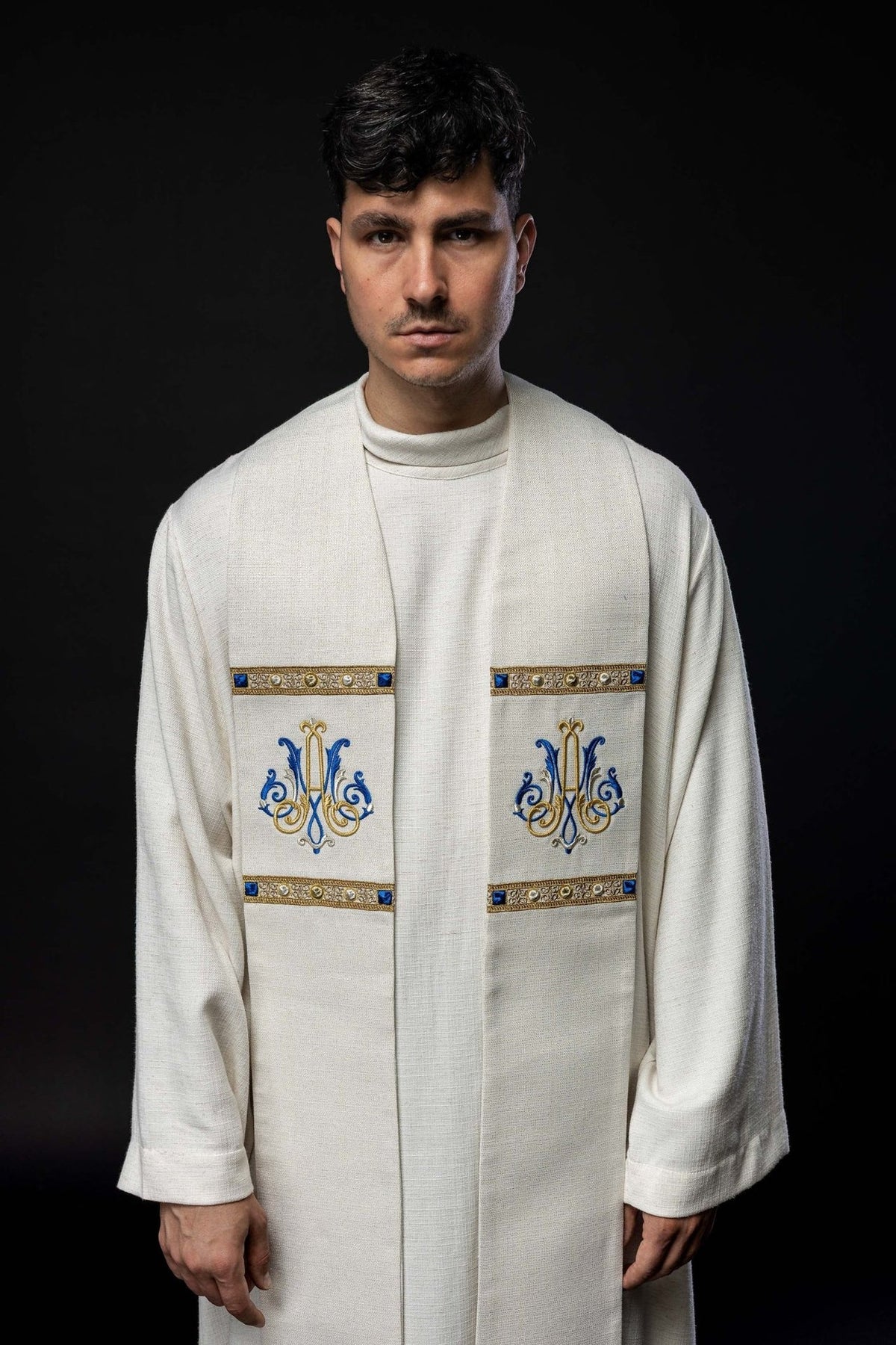 Ecru stole close-up showing gold and blue Marian embroidery and decorative orphrey