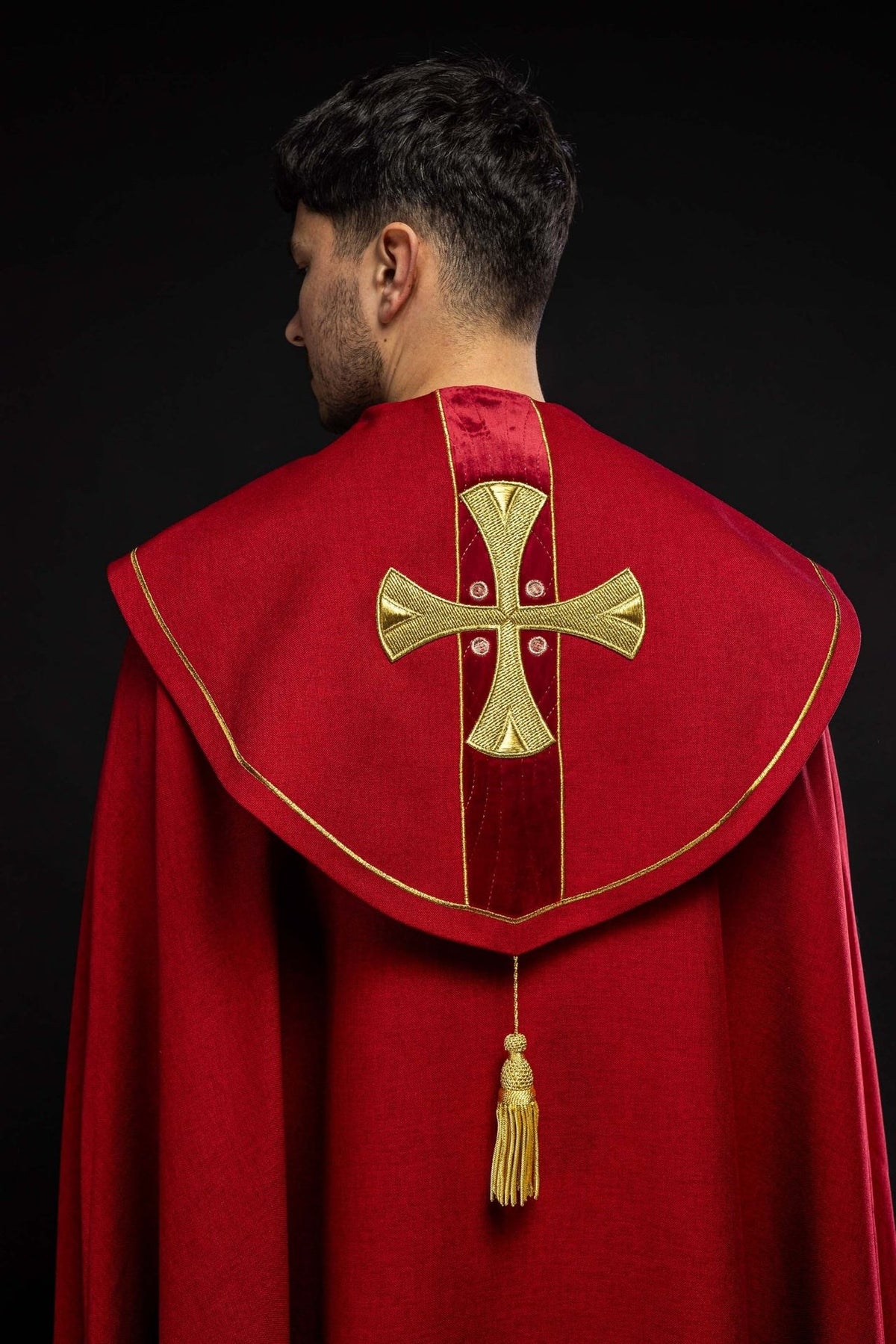 Red velvet cope, back view with embroidered gold cross and tassel
