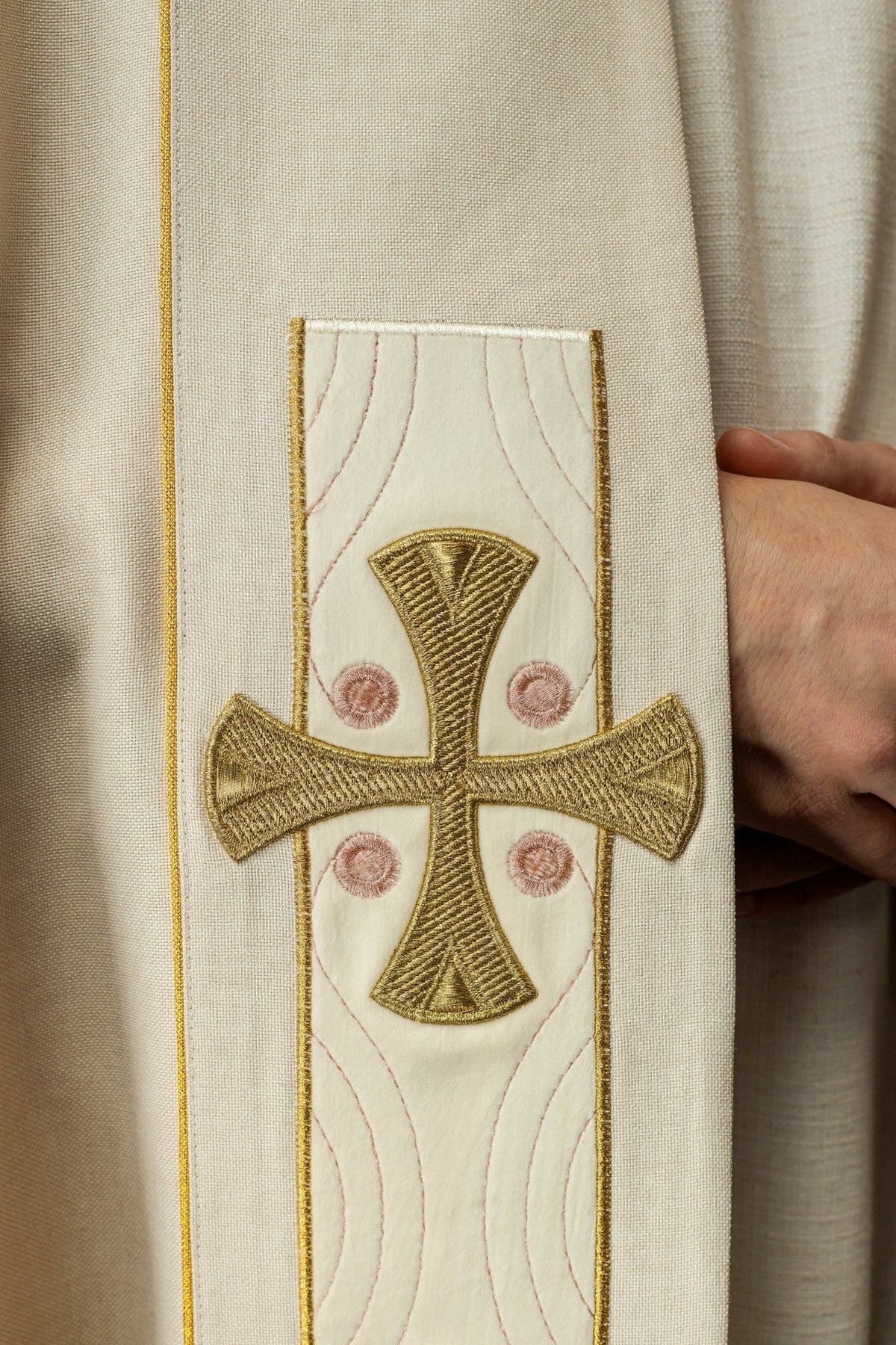 Ecru velvet cope, close-up of embroidered gold cross detail