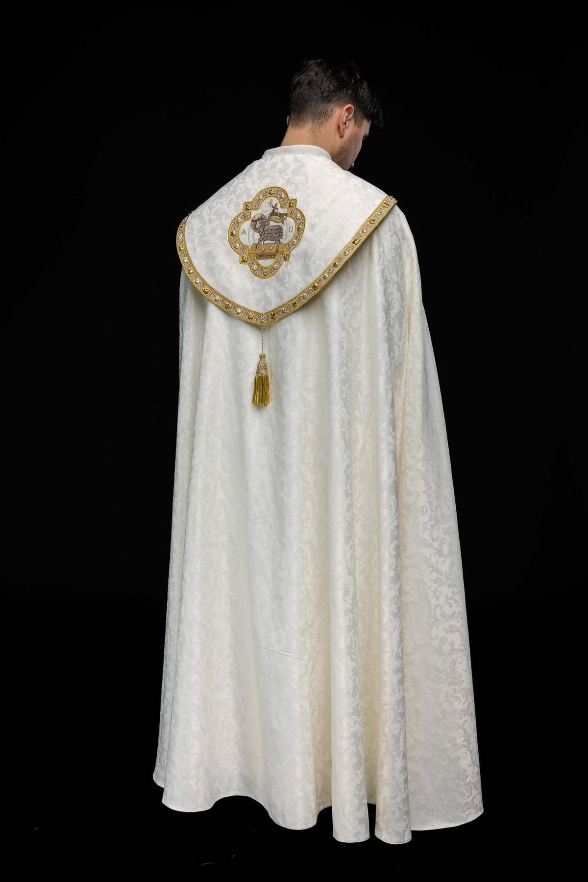 Ecru cope back view with Paschal Lamb embroidery, gold border and tassel