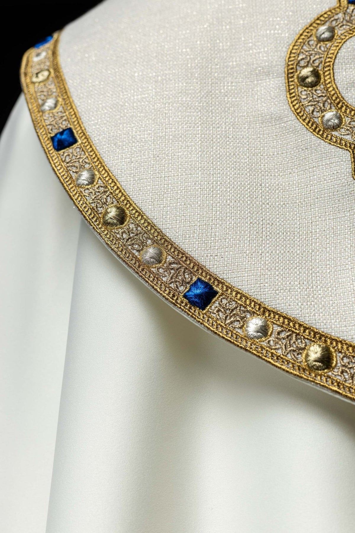 Embroidered cope side trim close-up with blue squares and gold motifs