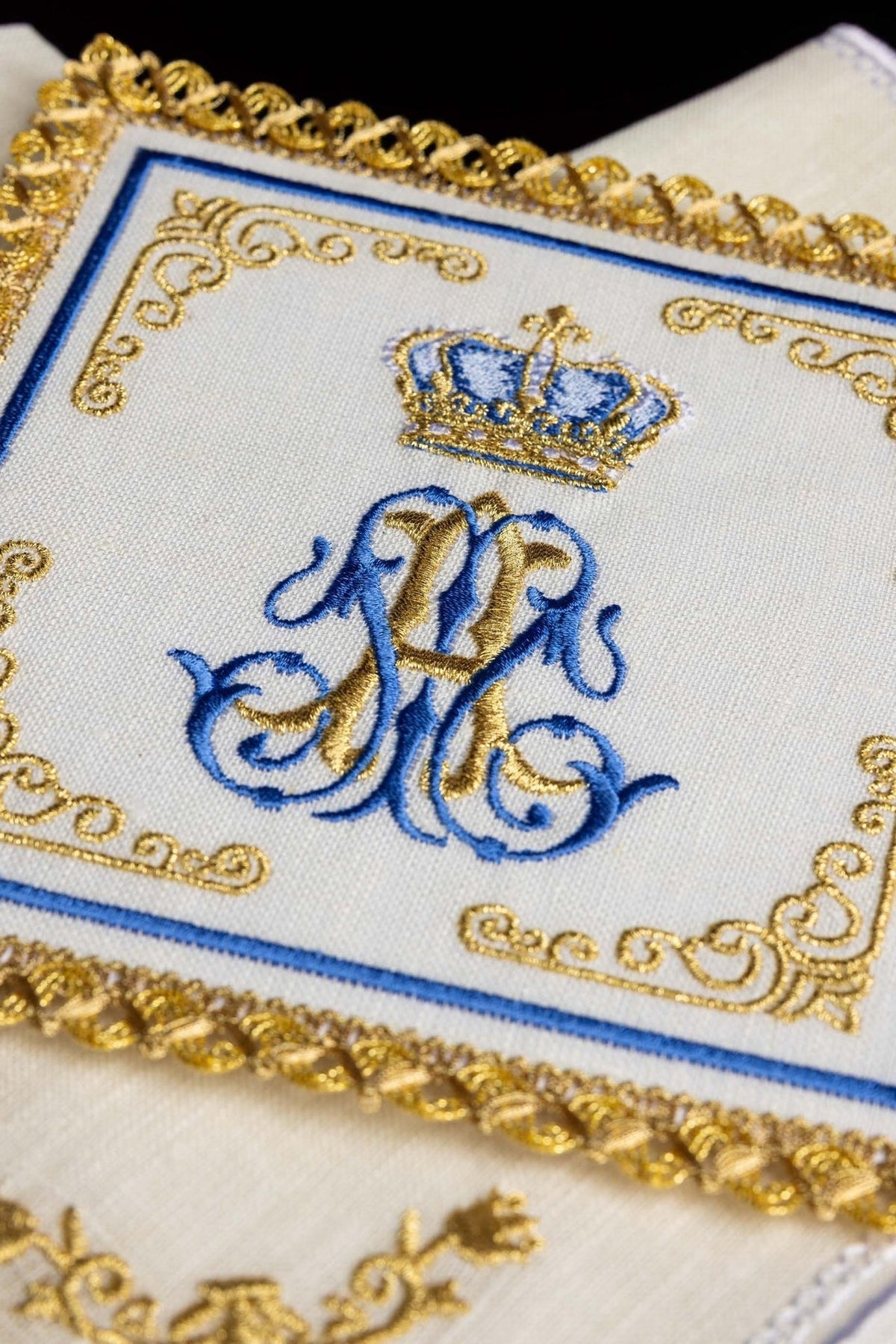 Altar linen set close-up showing raised gold trim and blue and gold Marian embroidery